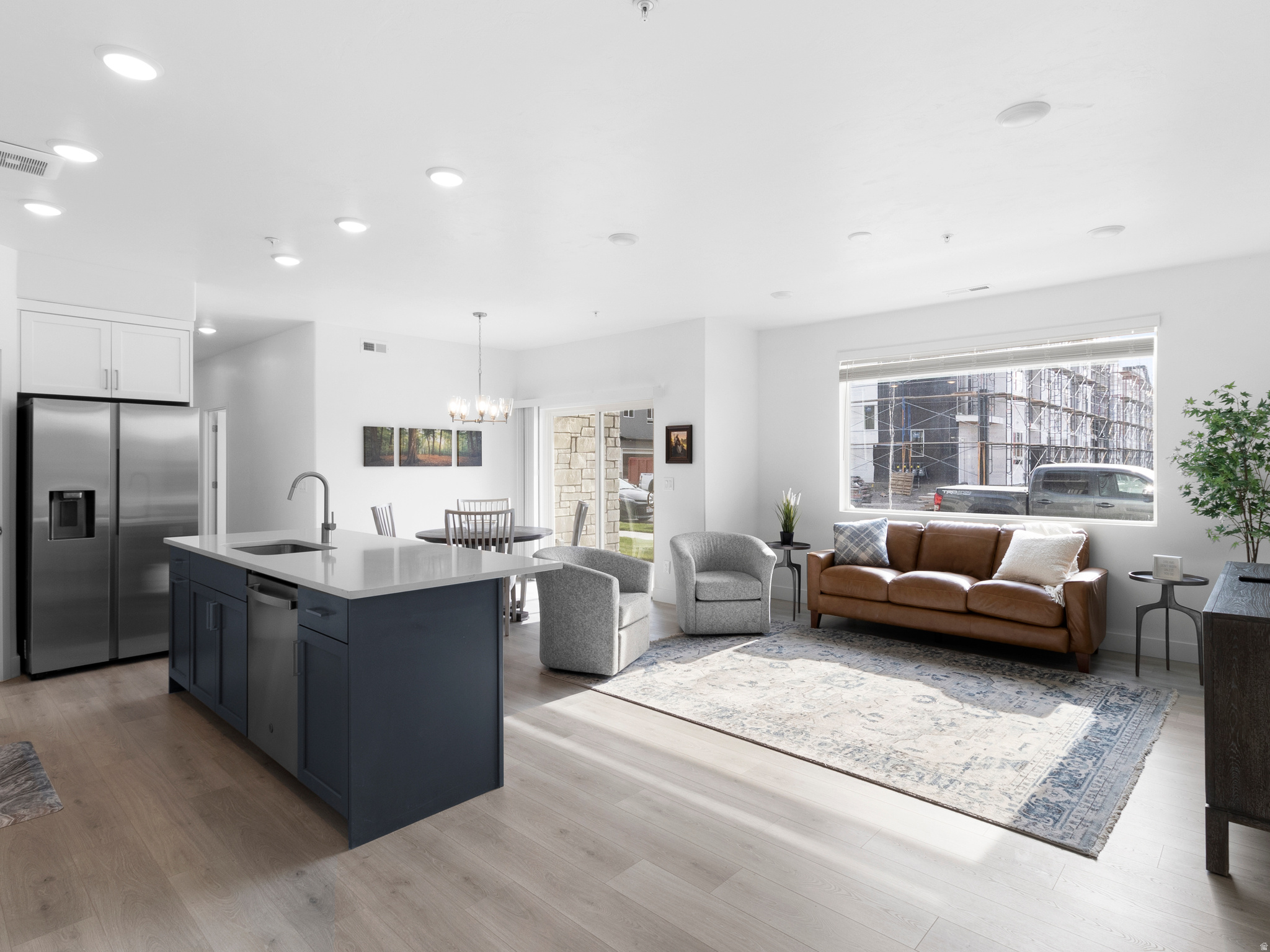 HUGE PRICE DROP!  Enjoy easy, single-level living in this spacious main-level condo featuring 9-foot ceilings and an open, inviting layout. The bright kitchen flows seamlessly into the family room and entry, creating a comfortable space for everyday living and entertaining. Convenient direct access from the attached garage means no stairs and effortless entry. Ideally located near I-15, FrontRunner, shopping, and dining-this home offers both comfort and unbeatable convenience.  Furniture negotiable with sale.