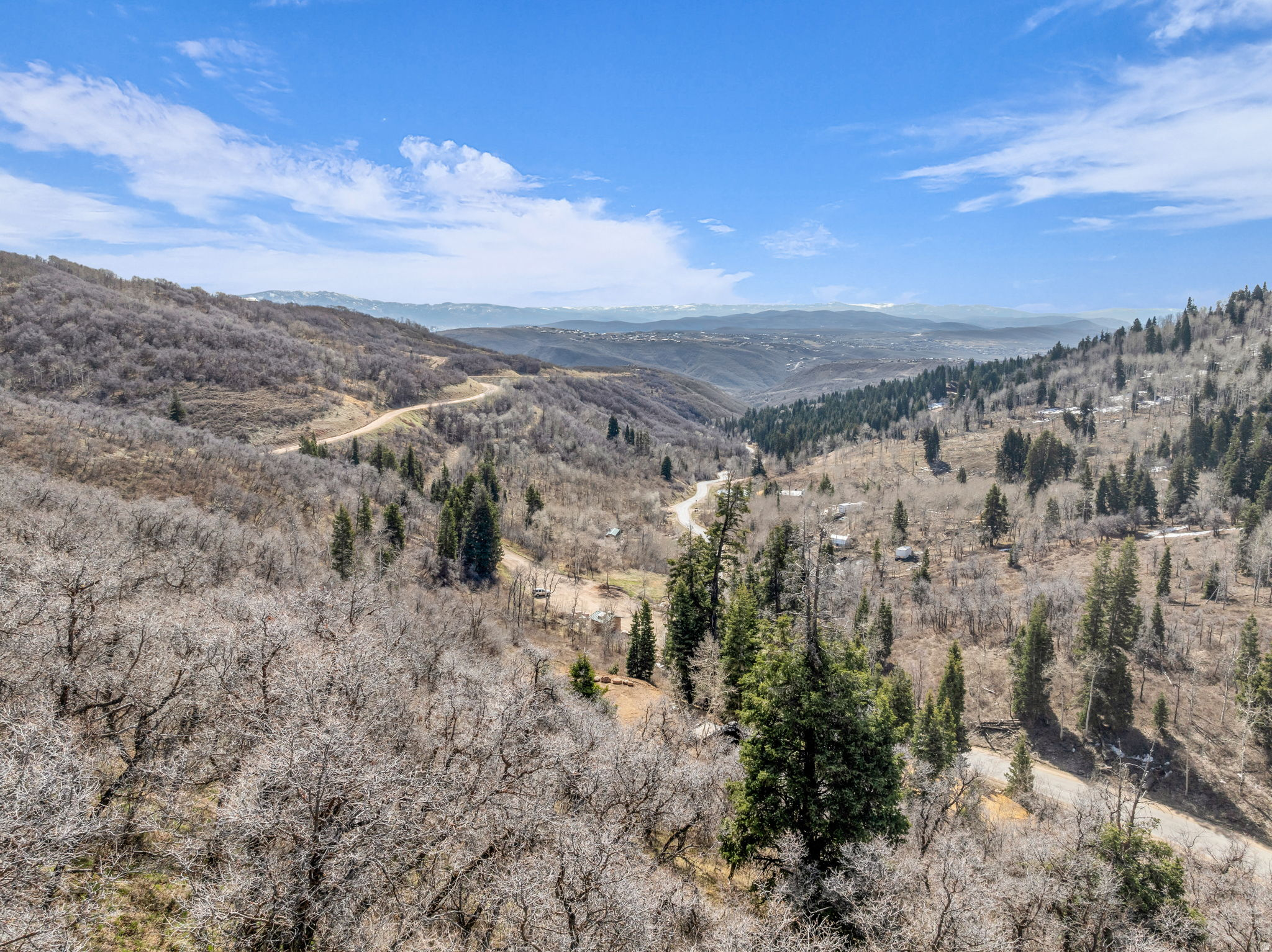 Where the pavement ends and this is exactly where your mountain adventure begins.  Set on 2.57 acres of some of the best land offered in Tollgate, this homesite delivers the kind of space that's getting harder to find-and the kind of views that are nearly impossible to replicate. It's not just acreage... it's perspective.  And the views? Honestly, "spectacular" doesn't quite do it justice. This is one you need to experience in person-I'll meet you there and let your reaction say the rest.  As you walk the property, you'll wind through old-growth pines and vibrant aspens, with that quiet, untouched feeling that makes Tollgate so special. Located just a short drive from Park City, you get the best of both worlds: true mountain seclusion with easy access to world-class skiing, dining, and year-round adventure.  Whether you're envisioning a weekend escape or a full-time mountain retreat, this is where you build something special.