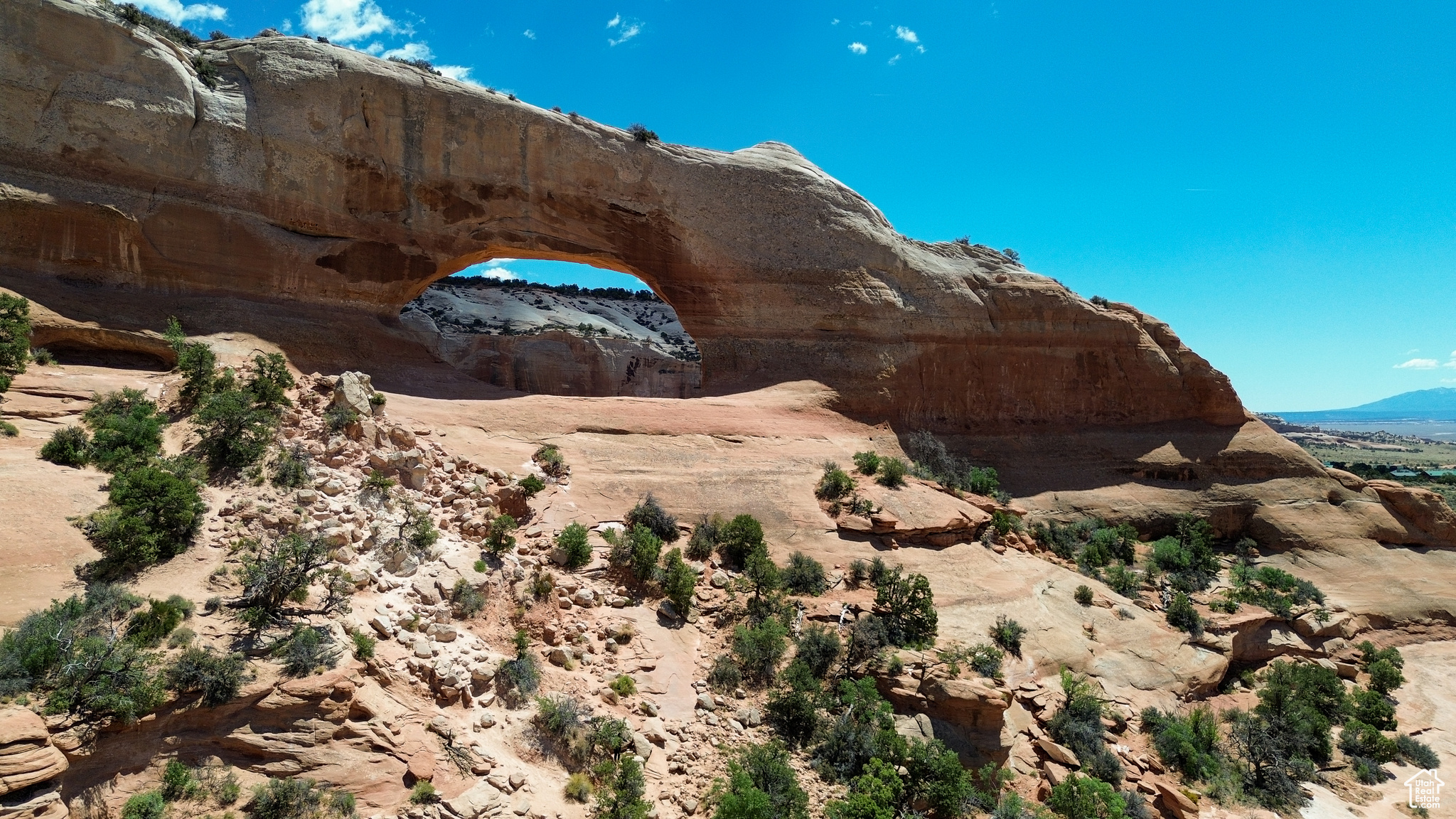Picturesque 2.6-Acre Lot in Wilson Arch Resort Community Nestled in the heart of red rock country, this parcel offers sweeping panoramic views of Wilson Arch, the Abajo Mountains, and dramatic desert cliffs. Located just 30 minutes south of main street Moab, this property combines natural beauty with modern convenience.The land features unique rock formations, mature pinyon and juniper trees, and wide open space-ideal for building a peaceful retreat, vacation home, or investment property. Enjoy easy access to nearby public lands, hiking trails, and world-renowned national parks like Canyonlands and Arches. Utilities are stubbed for: power, high-speed internet, and shared well water. Whether you're dreaming of a desert escape or looking for your next smart real estate move, this lot in the Community is a rare opportunity to own a piece of Utah's stunning red rock landscape. Lot lines marked with surveyor stakes and orange reflective 4ft poles.
