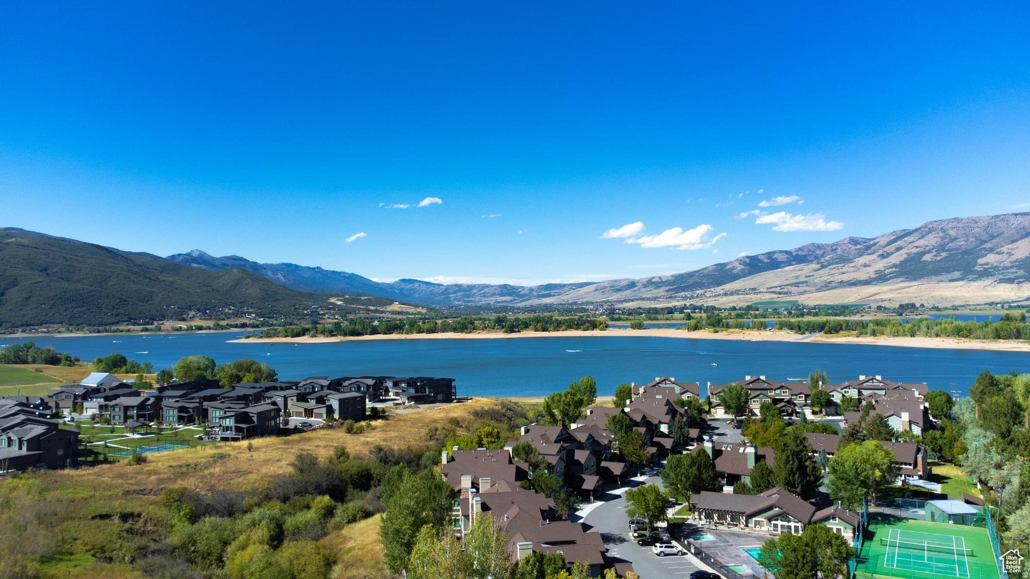 Nestled within Hawkins Creek gated community, this remarkable lot offers breathtaking panoramic views of Pineview Reservoir and the surrounding mountains. This perfect lot allows for a full daylight/walkout basement onto a flat backyard. Imagine waking up to the tranquil sights of nature's splendor and enjoying the peaceful ambiance of your own private sanctuary. With ample space to build your dream home and create the lifestyle you've always envisioned, this land presents an unparalleled opportunity for those seeking luxury, tranquility, and natural beauty in one of nature's most captivating settings.