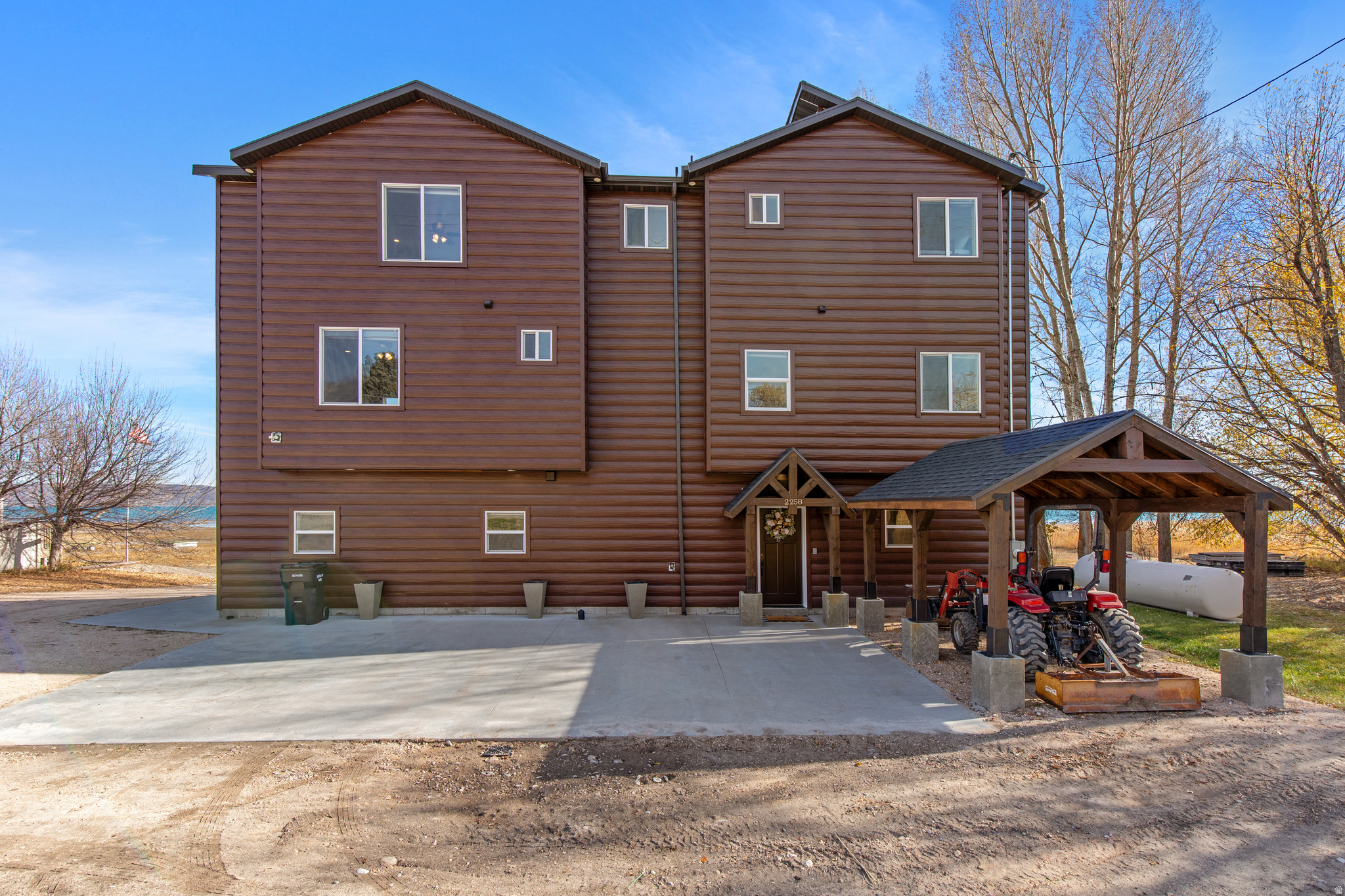 Enjoy incredible sunrise and sunset lake views-and everything in between-from every room of this stunning three-story beachfront home on the shores of Bear Lake in Fish Haven, Idaho. This beautifully designed property offers 4 bedrooms, 4 bathrooms, two spacious living rooms, and four fireplaces for cozy year-round living. Outdoor living is exceptional, with two balconies, a large concrete patio, gazebo, hot tub, fire pit, and storage shed. This log home is sold fully furnished and turn-key, ready for immediate enjoyment or use as a short-term rental, which is permitted. With nearly 200 feet of private beachfront, you can launch boats, paddleboards, or simply relax along the water's edge. Located just minutes from access to Fish Haven Canyon, you'll enjoy hundreds of miles of ATV/UTV and snowmobile trails leading into Cache National Forest, as well as endless opportunities for hiking, biking, and snowshoeing. With no HOA and unbeatable lakefront living, this property offers the perfect blend of recreation, relaxation, and investment potential on beautiful Bear Lake.