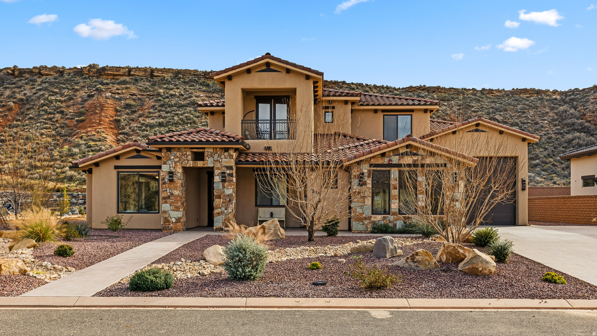 Just across the Virgin and tucked into some of Southern Utah's most stunning scenery, this exceptional home sits just 10-15 minutes from Zion National Park, offering quick access to iconic hiking, cooler mountain-influenced summers, and unforgettable views in every direction. Set on a generous lot, the property provides privacy, open space, RV parking, and plenty of room for all your outdoor toys-perfect for those who love to explore everything this area has to offer. Whether it's hiking, biking, off-roading, or weekend adventures in Zion, this home is designed to support an active Southern Utah lifestyle.