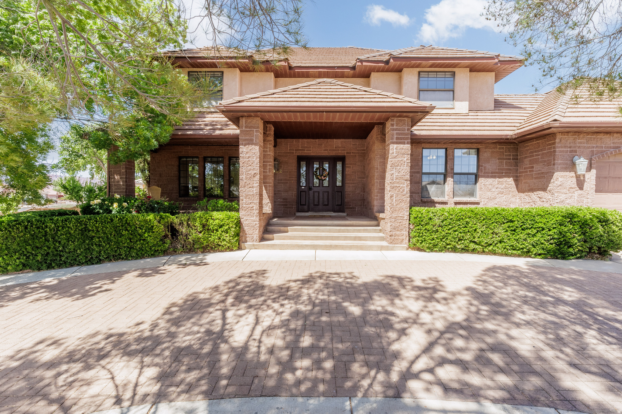 This charming brick home offers timeless storybook appeal with the warmth of a space that's been truly loved and lived in. Fresh paint throughout gives it a clean, updated feel, while still leaving room for you to add your own personal touch. Set on a large pie-shaped lot, the property features ready-to-plant garden beds and a backyard filled with mature fruit trees, including plums, pluots, and both red and green grapes-perfect for anyone who enjoys outdoor living or homegrown produce. Inside, you'll find an abundance of space with three separate living areas, giving everyone room to spread out comfortably. The flexible layout includes a main-floor bedroom with an attached bathroom, ideal for guests or multi-generational living. Throughout the home, bedrooms are thoughtfully connected with Jack-and-Jill bathrooms for added convenience. The primary suite is truly expansive-far beyond what "oversized" usually implies-complete with a large private bathroom and its own secluded deck, creating a peaceful retreat. Storage is plentiful throughout the home, offering more than enough space for everything you need (and then some). Major updates have already been taken care of, including both HVAC units replaced within the last five years. Additional highlights include an oversized two-car garage, circular driveway, covered front porch, RV parking, and ample space for additional vehicles-all with no HOA restrictions. Ideally located near clinics, shopping, restaurants, schools, and more, this home combines character, space, and convenience in one unique package.