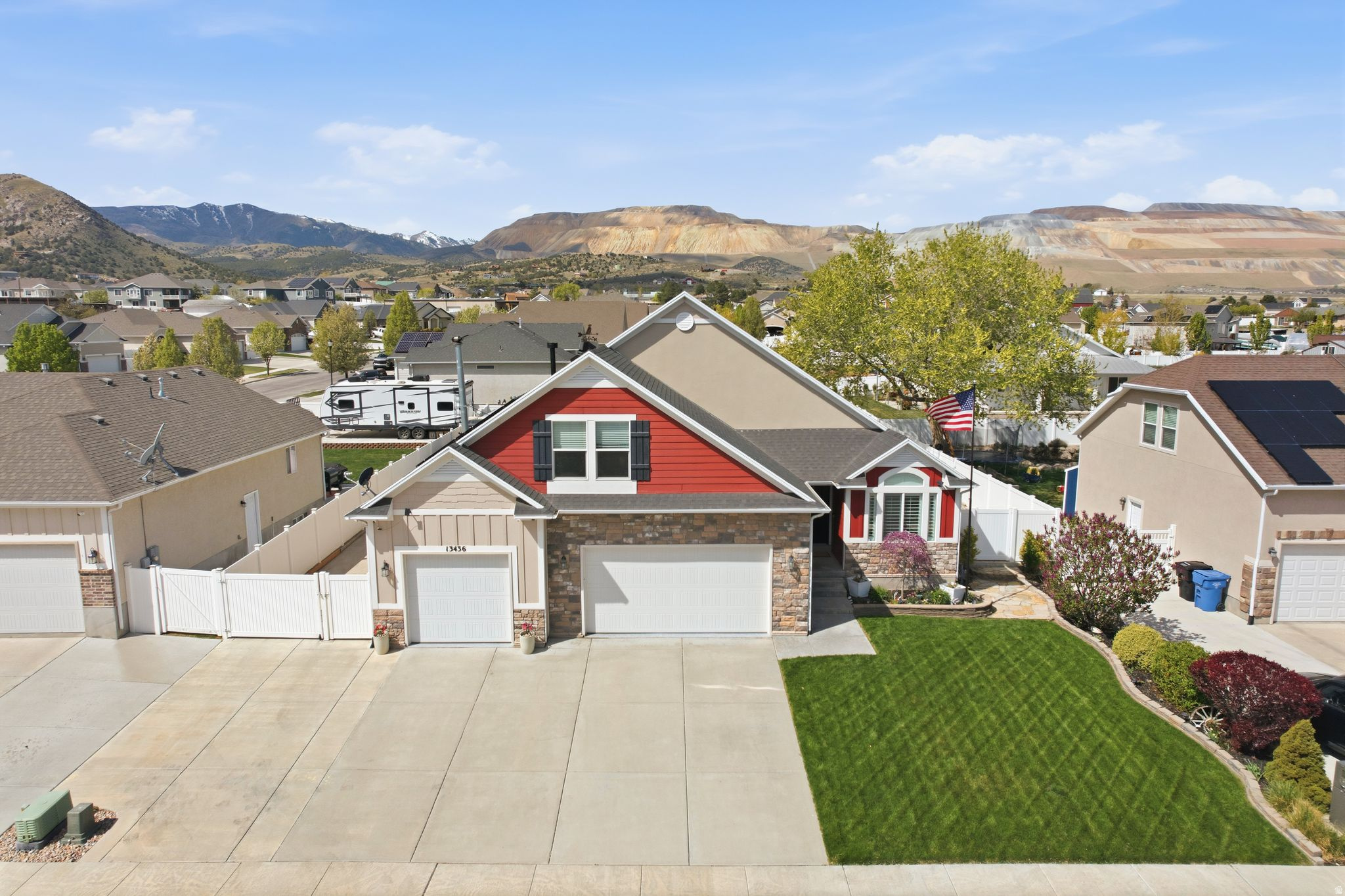 Fully upgraded and thoughtfully designed, this Herriman home stands out with paid-off solar, rare extended RV parking, and a finished lower level with kitchenette offering exceptional flexibility. Opportunities like this are limited, especially at this price point. The main level is built for convenience and comfort, featuring three bedrooms including a spacious primary suite and main-level laundry. Vaulted ceilings and natural light enhance the open-concept living space, while the kitchen offers granite countertops, custom cabinetry, stainless appliances, and a seamless connection to the covered deck for indoor-outdoor living. Downstairs, the fully finished basement creates space to live, host, or adapt with a large rec room, wood stove, bedroom, full bath, exercise room, storage, and kitchenette setup. The exterior delivers both curb appeal and function with a fully landscaped yard, garden beds, covered deck, three-car garage, and a hard-to-find RV parking area that adds real usability and value. Ideally located near trails, shopping, dining, and schools, this home offers a strong combination of lifestyle, efficiency, and versatility in one of Herriman's most desirable areas.