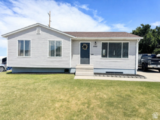 This charming 3-bedroom, 1-bath home offers a modern updated feel with an open-concept layout that creates a warm and inviting space perfect for families.  Enjoy new carpet throughout along with fully grassed front and back yards that provide plenty of room for kids, pets, and entertaining. The fully fenced backyard features a storage shed, vegetable garden area, mature shade tree, and a fire ring ready for family nights around the fire pit.  The basement is already framed and ready to be finished, giving buyers a great opportunity to build equity and create additional living space to fit their family's needs.  Recent updates include a new water heater installed in 2025 and a recent A/C tune-up for added peace of mind. New vinyl flooring throughout the home and new carpet in the bedrooms.   Conveniently located within walking distance to Sterling Elementary and a nearby park, this home is also just a short drive to Settlement Canyon Reservoir and surrounding outdoor recreation, giving you easy access to fishing, hiking, and nature right in your backyard. Plus, enjoy the convenience of being within commuting distance to Salt Lake City and the SLC International Airport.