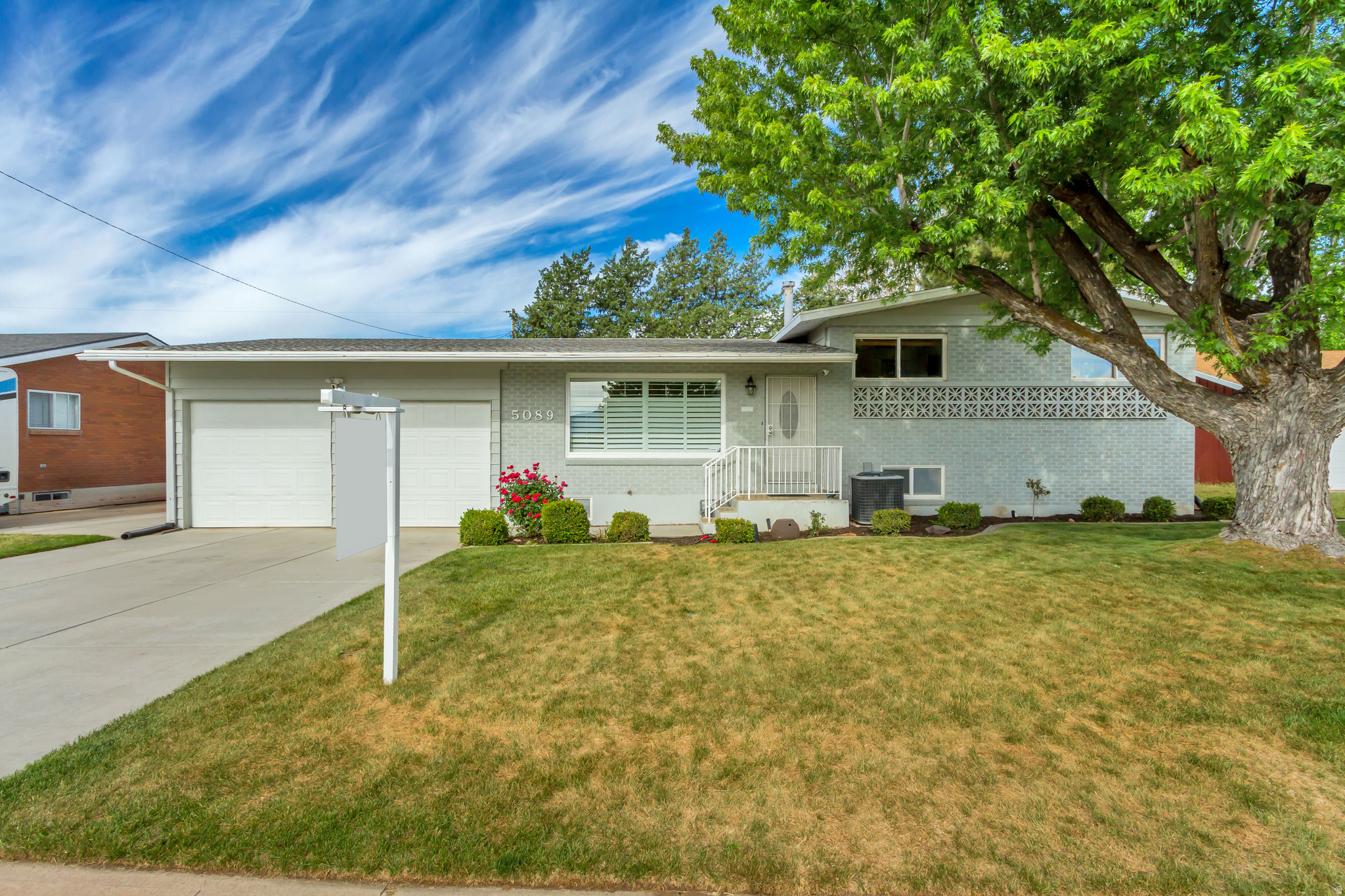 Welcome home to this charming, upgraded Roy property featuring a modern open-concept design and spacious living throughout. From the moment you walk in, you'll appreciate the large rooms, updated bathrooms, and beautifully remodeled kitchen designed for both style and functionality.  The kitchen showcases stainless steel appliances, quartz countertops, a large island with built-in USB ports, under-cabinet lighting, and soft-close cabinetry. Major system upgrades provide peace of mind, including a new water heater, water filtration system, furnace with HVAC tune-up, sump pump, and a new main water line connected to the street.  Additional features include an oversized 2-car garage, cozy electric fireplace in the basement, and a secluded private backyard complete with an enclosed patio room - perfect for relaxing or entertaining year-round.  Vacant and move-in ready, this home is packed with value, comfort, and modern upgrades throughout!