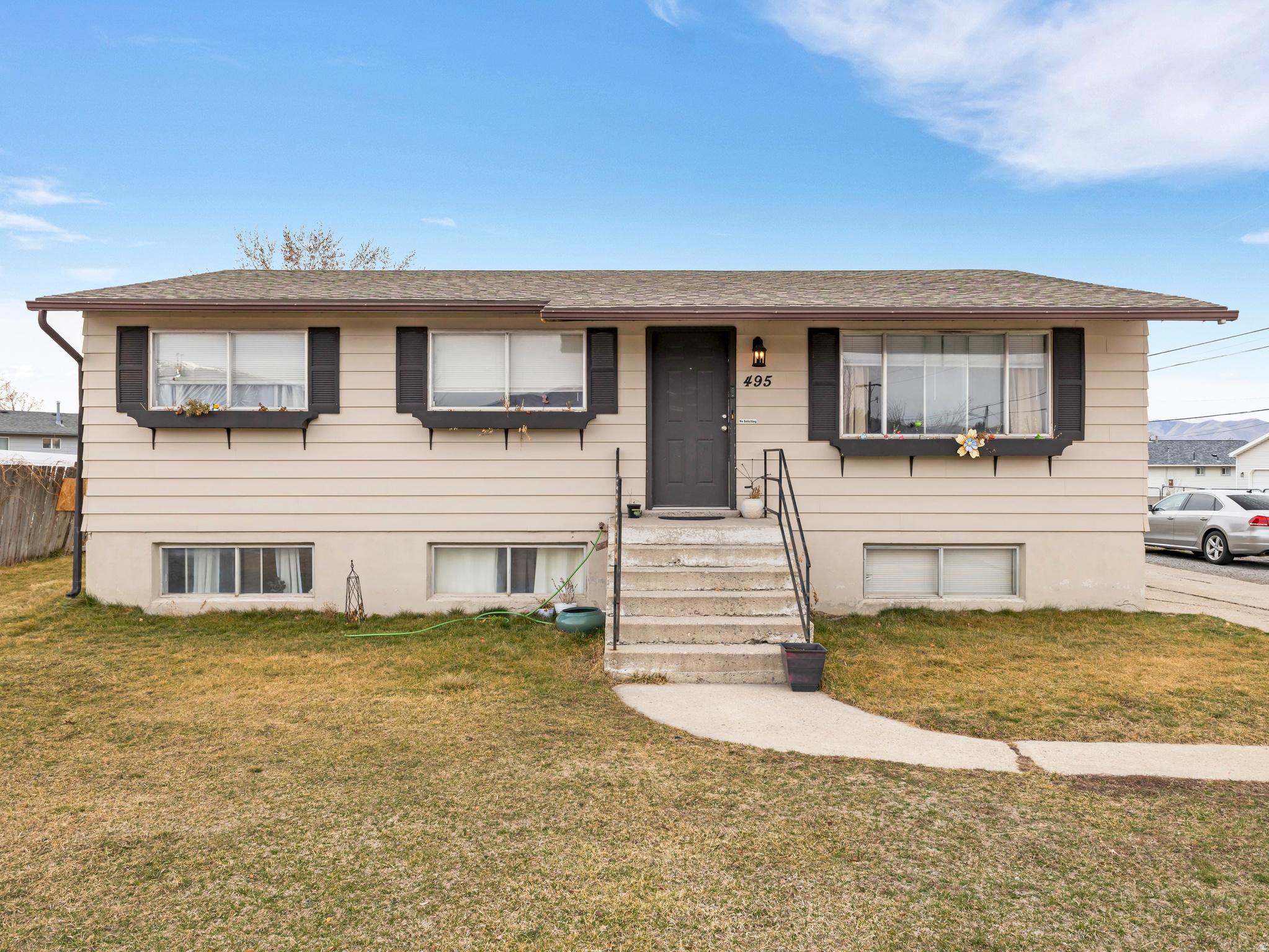 Listed below appraisal value to sell quickly! This 6-bed, 2-bath home is located on a spacious corner lot with plenty of additional parking in a highly coveted neighborhood in NW Lehi with NO HOA. Includes a full basement MOTHER-IN-LAW that provides a great space for guests or the perfect opportunity to offset your mortgage. Basement rents for $1800 monthly.  This home is a rare find in a prime location. New carpet recently installed throughout the basement. Seller Financing available.