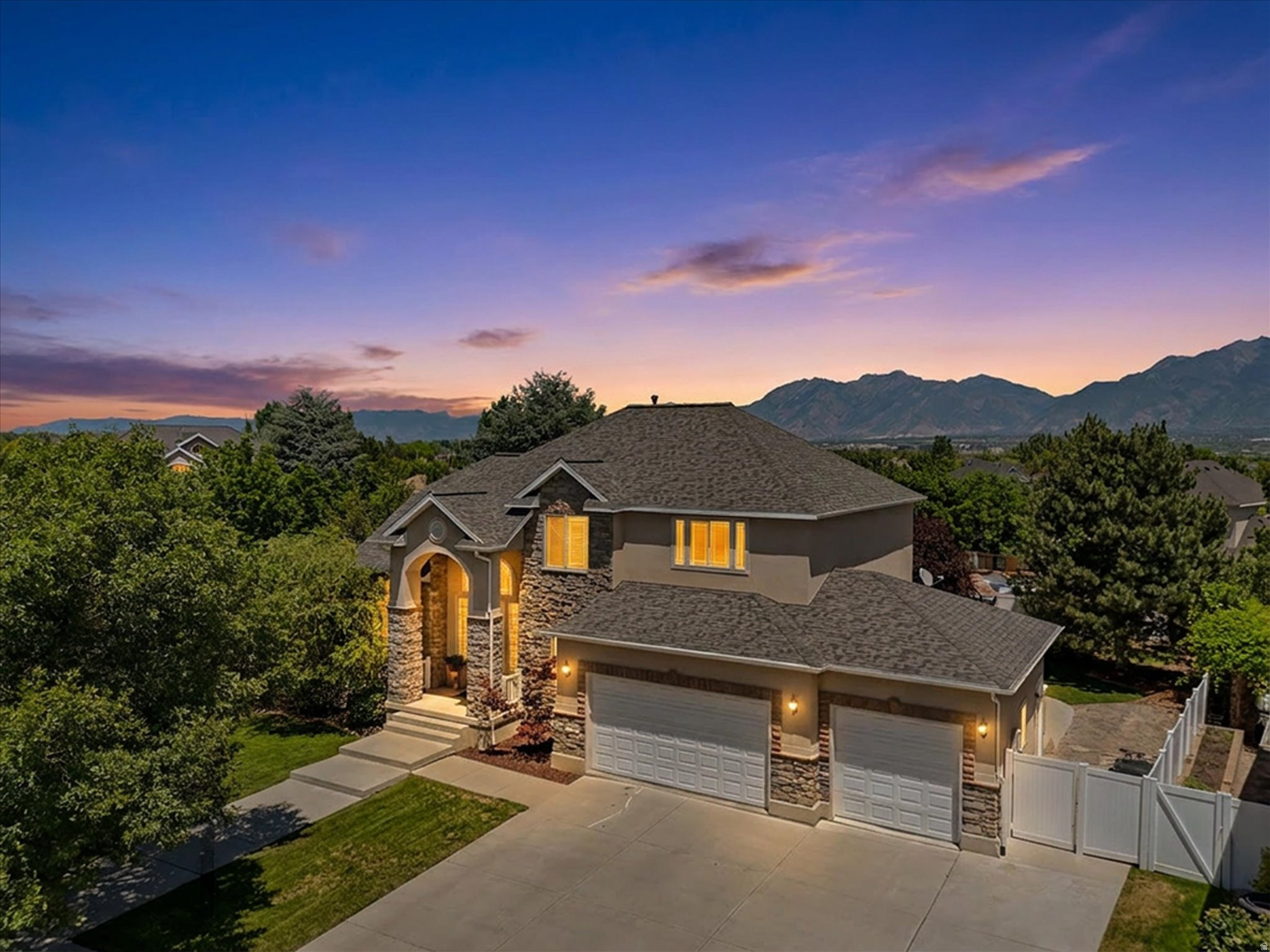 Welcome to Jordan Meadows and your new home on Green Grass Court - where luxury, comfort, and incredible amenities come together in one unforgettable property.  The home itself is impressive, but the extensive upgrades and inclusions truly set it apart. The main level features an updated kitchen with new countertops and appliances, complemented by a massive butler's pantry offering exceptional storage and prep space. Step outside to the lower deck and enjoy breathtaking views, an outdoor furniture set with fire pit, outdoor TV, built-in heaters and Bluetooth speakers - perfect for entertaining or relaxing evenings at home.  Upstairs, the primary suite is a true showstopper. This private retreat features its own sitting area with fireplace and custom kitchenette, a massive walk-in closet, dedicated mini-split HVAC system (BRAND NEW in 2026), and a private deck complete with incredible views that truly must be experienced in person. Three additional spacious bedrooms and a full bathroom complete the upper level.  The fully finished walkout basement offers an abundance of open living space, a cozy gas fireplace, a kitchenette, an additional bedroom, and a full bathroom - ideal for guests, entertaining, or multi-generational living.  Major recent upgrades include:  NEW roof (November 2025).  NEW kitchen appliances (2021).  NEW water heater (2022).  NEW copper plumbing manifold system (2023).  NEW HVAC air scrubber (2023).  And the inclusions? Even better:  Hot tub, lower deck fire pit set, outdoor television, TWO sets of washers and dryers, backyard Lifetime shed, trampoline, basketball stand, swing set and the large basement freezer.  Finish it all off with RV parking, a huge corner lot, and an amazing neighborhood, and you'll find yourself at home!  All figures are provided as a courtesy estimate and are not guaranteed.  Buyer is advised to independently verify all listing information.
