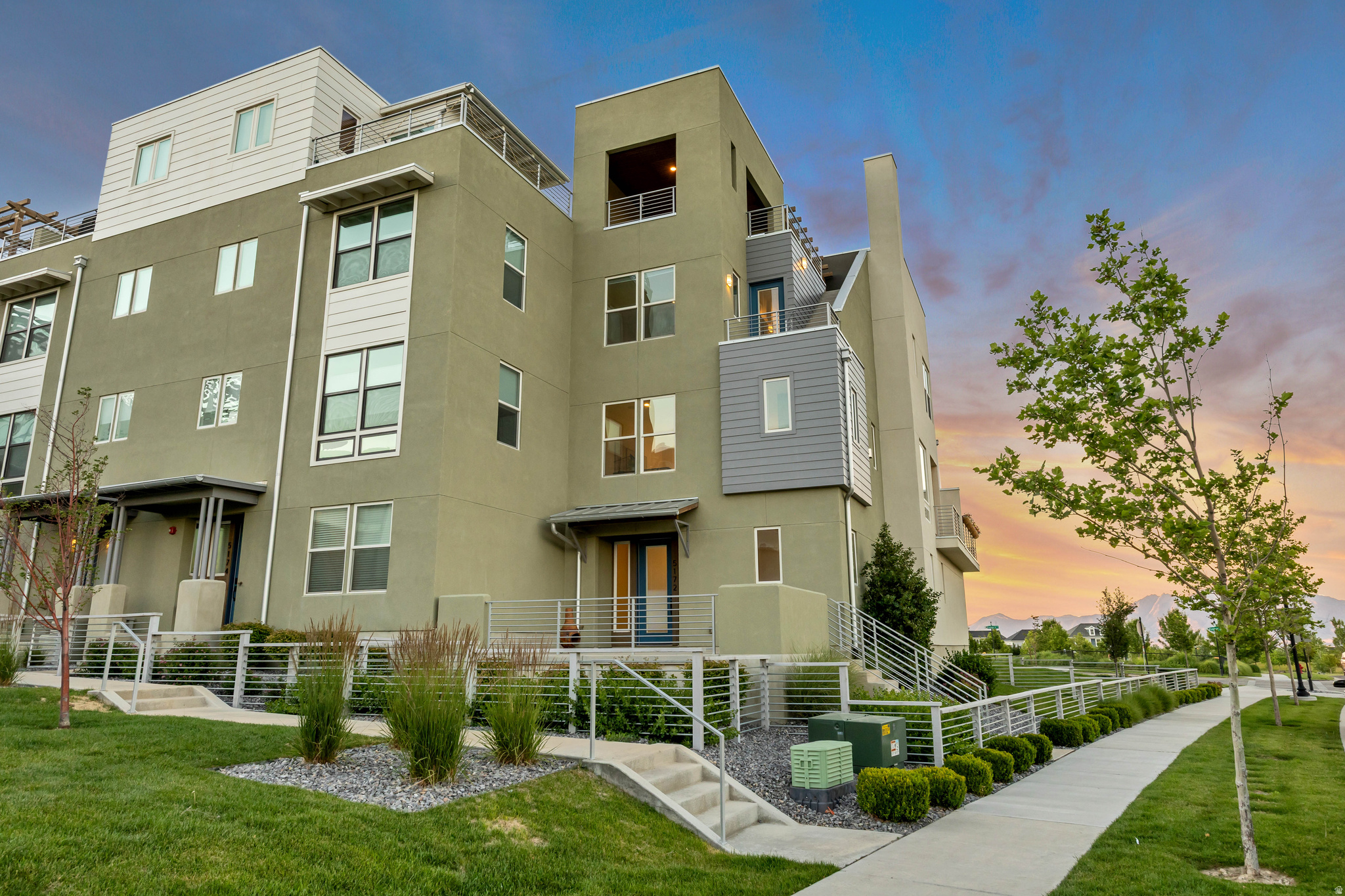 Experience elevated living in one of Daybreak's most impressive townhomes. Thoughtfully designed with high end finishes and an exceptional floor plan, this home features a stunning kitchen, a spacious primary suite, and inviting indoor and outdoor living spaces throughout. Just off the kitchen, a private deck offers the perfect spot for grilling or enjoying your morning coffee. The true showpiece of the home is the incredible rooftop deck, complete with a fireplace, gazebo, and breathtaking panoramic views of the entire valley and surrounding mountains. Whether you're entertaining friends, watching the sunset, or relaxing under the stars, this one of a kind outdoor space is unlike anything else. A large front patio provides yet another place to unwind, while the oversized two car garage offers additional storage and everyday convenience. Located in the heart of Daybreak with easy access to parks, trails, shopping, dining, and all the community amenities, this move in ready townhome offers an exceptional lifestyle in one of Utah's most sought after communities. VACANT & EASY TO SHOW