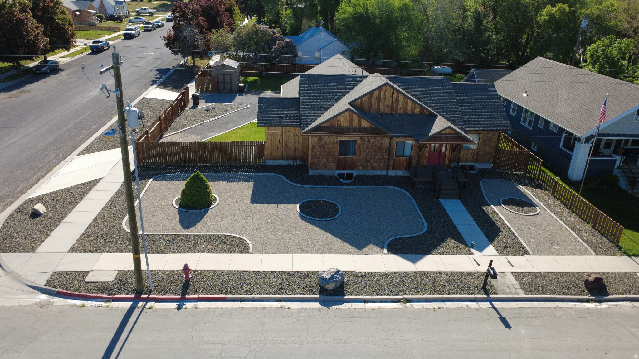 Welcome to this stunning and immaculate custom home that perfectly blends comfort, functionality, and curb appeal. From the moment you arrive, you'll appreciate the beautiful cedar siding, manicured landscaping with concrete curbing, automatic sprinkler system, and multiple access gates leading to the spacious backyard. The exterior also features RV parking with RV hookups, a cozy fire pit area, a nice-sized deck perfect for entertaining, and an oversized 3-car garage with extra depth on one side for added storage or workspace.  Inside, you'll find a warm and inviting floor plan featuring 4 bedrooms and 3 bathrooms, a spacious family room, and abundant storage throughout. The beautiful LVP flooring flows seamlessly  Welcome to this stunning and immaculate custom home that perfectly blends comfort, functionality, and curb appeal. From the moment you arrive, you'll appreciate the beautiful cedar siding, manicured landscaping with concrete curbing, automatic sprinkler system, and multiple access gates leading to the spacious backyard. The exterior also features RV parking with RV hookups, a cozy fire pit area, a nice-sized deck perfect for entertaining, and an oversized 3-car garage with extra depth on one side for added storage or workspace. through the home, complementing the granite countertops and stylish finishes. The kitchen offers a convenient breakfast bar, dishwasher, and ample cabinetry, making it ideal for everyday living and entertaining alike. The oversized master suite provides a relaxing retreat with a large bedroom, walk-in closet,  luxurious garden tub and a large cultured marble shower. Additional highlights include large closets throughout, a main-floor laundry room, water softener, on-demand water heater, and electric A/C for year-round comfort. This property truly offers the complete package - quality, space, functionality, and exceptional pride of ownership both inside and out.
