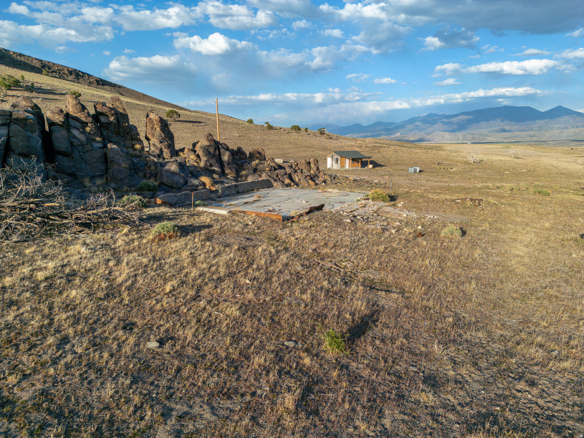 Escape the city and experience true peace and quiet on this expansive 80acre Elberta retreat, made up of two parcels (351040016 & 351040013). Offering unmatched privacy and wideopen space, this property is ideal for offgrid living, recreation, or building your dream getaway. The land is currently off grid, but power is available through Rocky Mountain Power. A cabin once stood on the property but has since burned down, leaving behind a BUILDABLE LOT zoned M&G1 (Mining & Grazing 1). An older septic system and an existing well remain; the well will require a water right to be reactivated. Surrounded by natural beauty, wildlife, and panoramic views, this secluded acreage is perfect for a cabin site, hunting basecamp, or longterm land investment. Governmentowned land borders the west side, ensuring lasting privacy with no expected neighbors in that direction. Square footage and acreage figures are provided as a courtesy from county records; buyers are advised to obtain independent measurements.