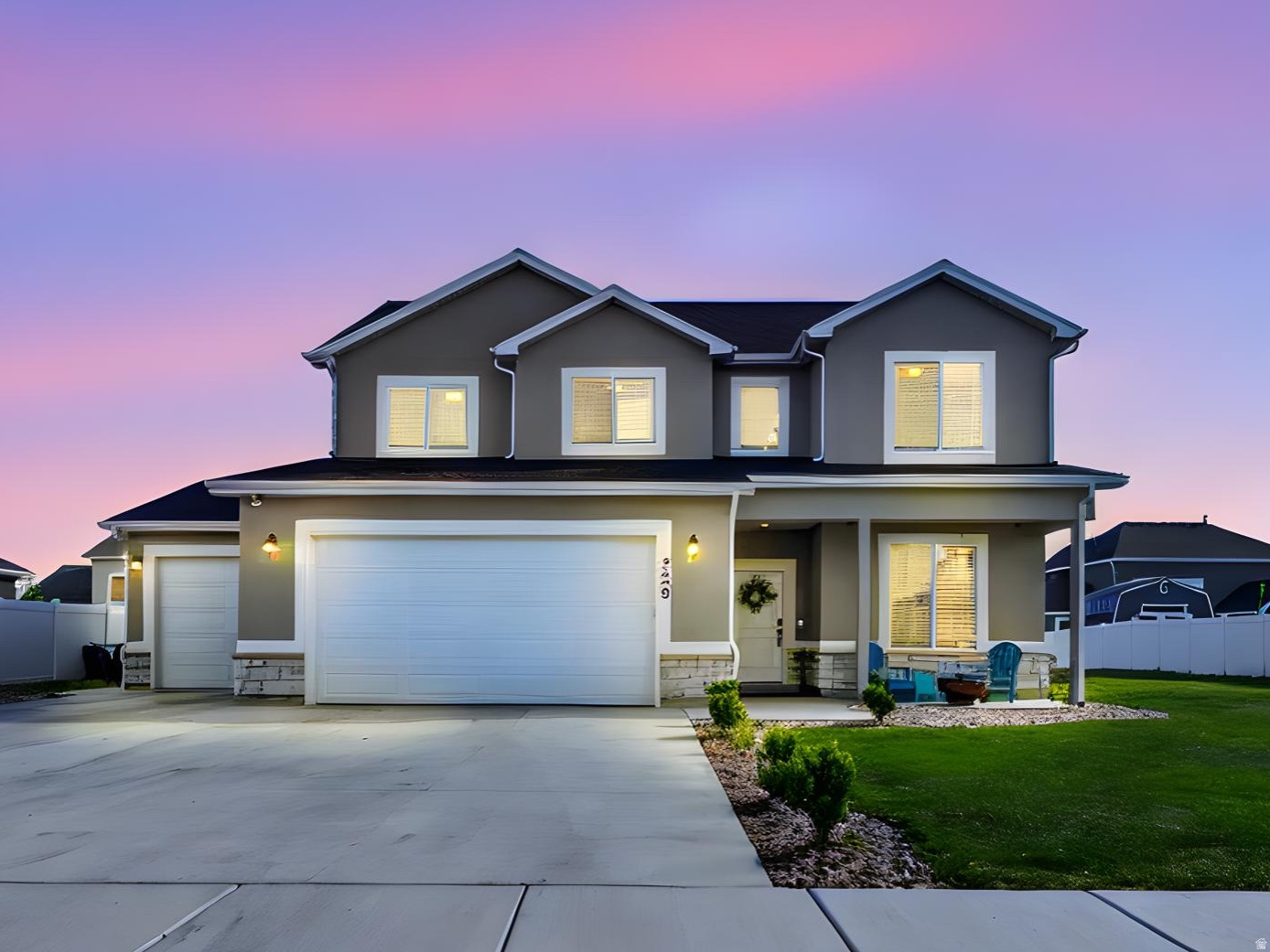 Need garage space? This 2023-built Farr West home delivers with an oversized extra-tall, extra-deep garage, a wide driveway, and dedicated side parking that can be hard to find.  Offering 4 bedrooms plus a dedicated office, 2.5 bathrooms, and a second family room, this two-story home combines flexible living space with practical functionality. The main level features a private office with glass French doors, a mudroom, half bath, and an open-concept kitchen complete with a gas range, large island, walk-in pantry, and seamless flow into the living room with a cozy gas fireplace.  Upstairs, the spacious primary suite includes a walk-in closet and ensuite bath with a glass-enclosed shower. Three additional bedrooms, a full bathroom, laundry room, and an additional family room provide plenty of room for everyday living.  Situated on a fully irrigated 0.27-acre lot in a completed neighborhood with no surrounding construction, this home is move-in ready inside and out. Additional features include fiber optic wiring for high-speed internet and a dedicated switch for exterior roofline lighting.  Enjoy beautiful views of Ben Lomond Peak and convenient access to 2700 North, Hill Air Force Base, and the growing retail corridor, including the new Target development nearby. If you've been searching for a newer home with exceptional garage space, parking, and flexible living areas, this one deserves a closer look.