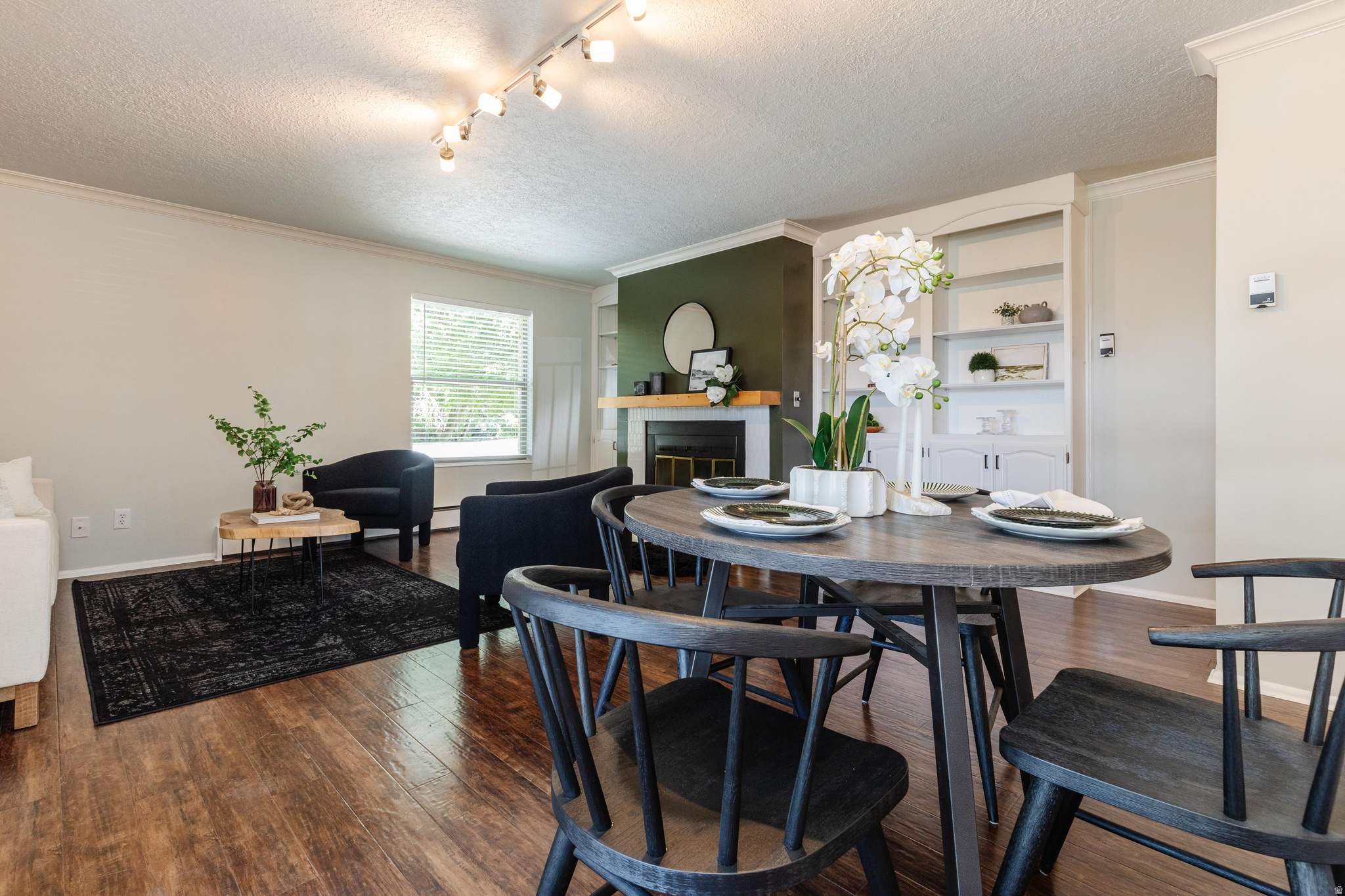 Updated 2 bed, 1.5 bath condo offering 1,257 sq ft in central Logan. Bright open-concept layout features hardwood floors, abundant natural light, and a cozy wood-burning fireplace. Large laundry room with washer and dryer. Finished basement storage area plus cedar closet. Enjoy the fenced and covered patio and peaceful courtyard with mature trees and stream. Prime location near Utah State University, grocery stores and shopping & CVTD transit center.