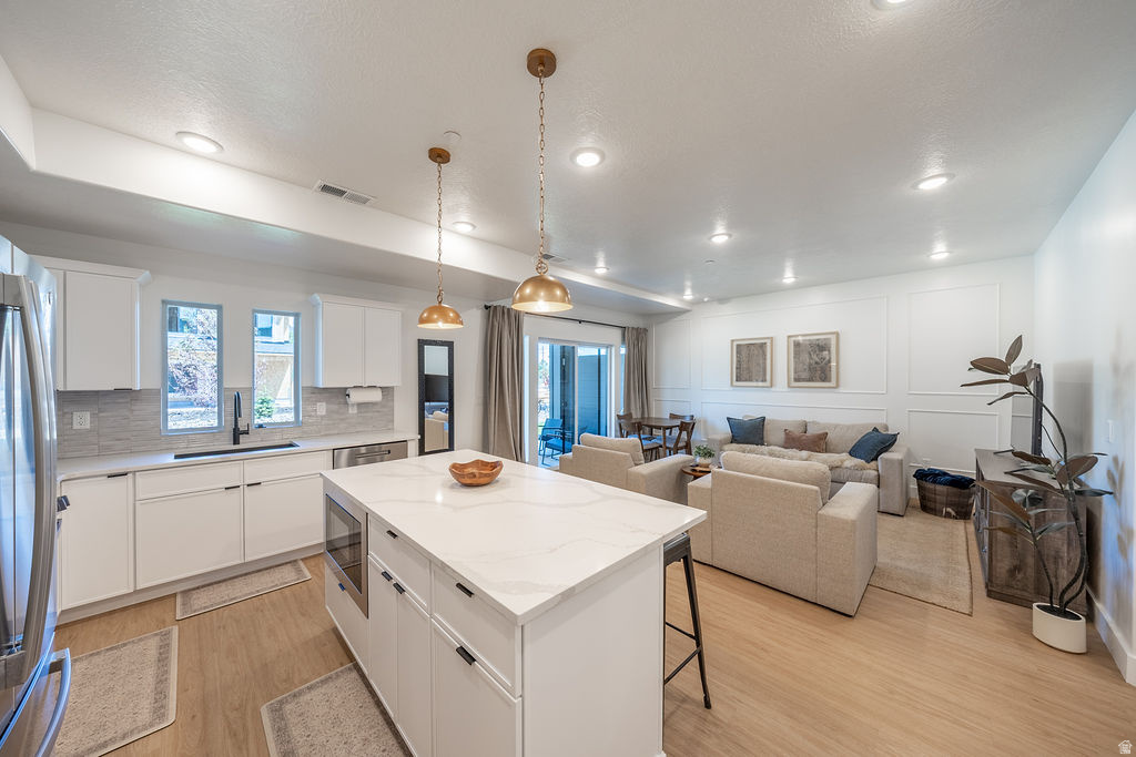 EVERYTHING (furniture, housewares, hot tubs) included, bright open main living area w/upgraded lighting and custom molding. Smart locks, smart thermostat & fiber internet.  Huge primary suite. 2nd level large covered deck. Perfect location for outdoors enthusiasts. Minutes from Snowbasin, Pineview Reservoir, Powder Mountain, Nordic Valley, and Causey Reservoir with year round recreation. Ideal for investors as a ready to go rental, buyers wanting a low maintenance getaway or a first time homebuyer w /high end taste on a budget.  Property has solid STR history. Contact agent for details.