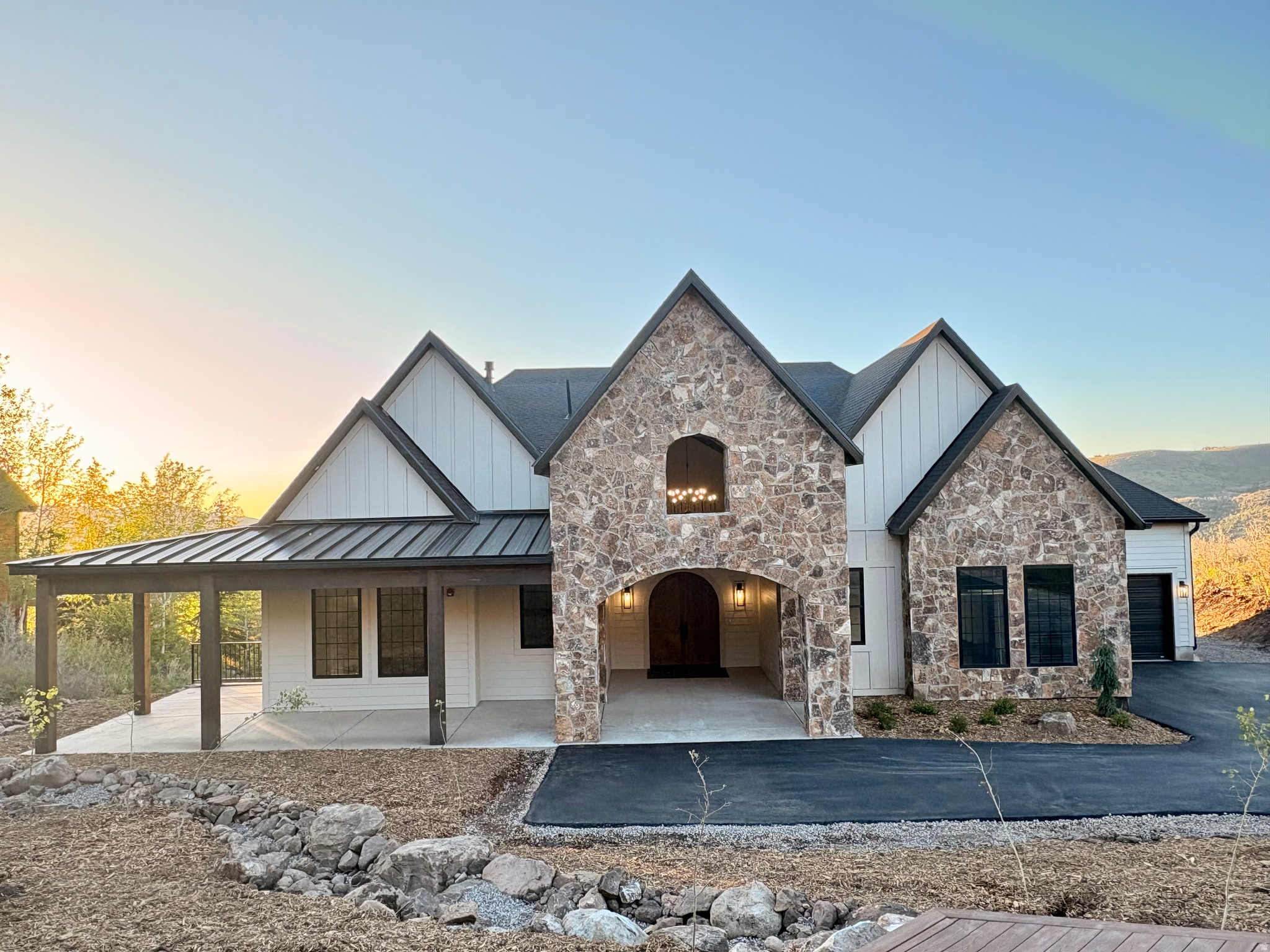 Enjoy serenity and abounding nature in this custom mountain home. The main floor features an open concept great room, spacious office and an incredible master suite. Enjoy the gourmet kitchen which boasts Viking appliances, a 9' island and butler's pantry. Gather your friends and family in the walkout basement's large rec room with wet bar, covered patio and second patio which is hot tub ready.  The basement also has 3 bedrooms with 3 ensuite bathrooms and a second laundry room. Relax on the covered deck as you take in unlimited mountain and Jones Lake views, gorgeous sunsets, and the open space behind the home which ensures that the views will never be blocked. Hike and bike on private trails and enjoy paddle boarding on one of the community lakes. Cozy up to the fireplaces in the winter after a day on your snowmobiles, which you can ride directly from your garage to the roads that access thousands of acres of forest land. The insulated, oversized 3+ garages are ready for your vehicles and recreational toys. The home has upgraded insulation with single cell foam on all the exterior walls and then a blown in insulation added to the foam layer for optimal comfort.   Additionally, there are quality Anderson windows and Martin insulated garage doors. Timber Lakes is a gated community with roaming security and road snow removal. With only 30 minutes to Deer Valley Resort and 1 hour to the SLC airport this is the perfect place for your primary residence or recreational home. Seller will assist buyer with an interest rate buy-down.
