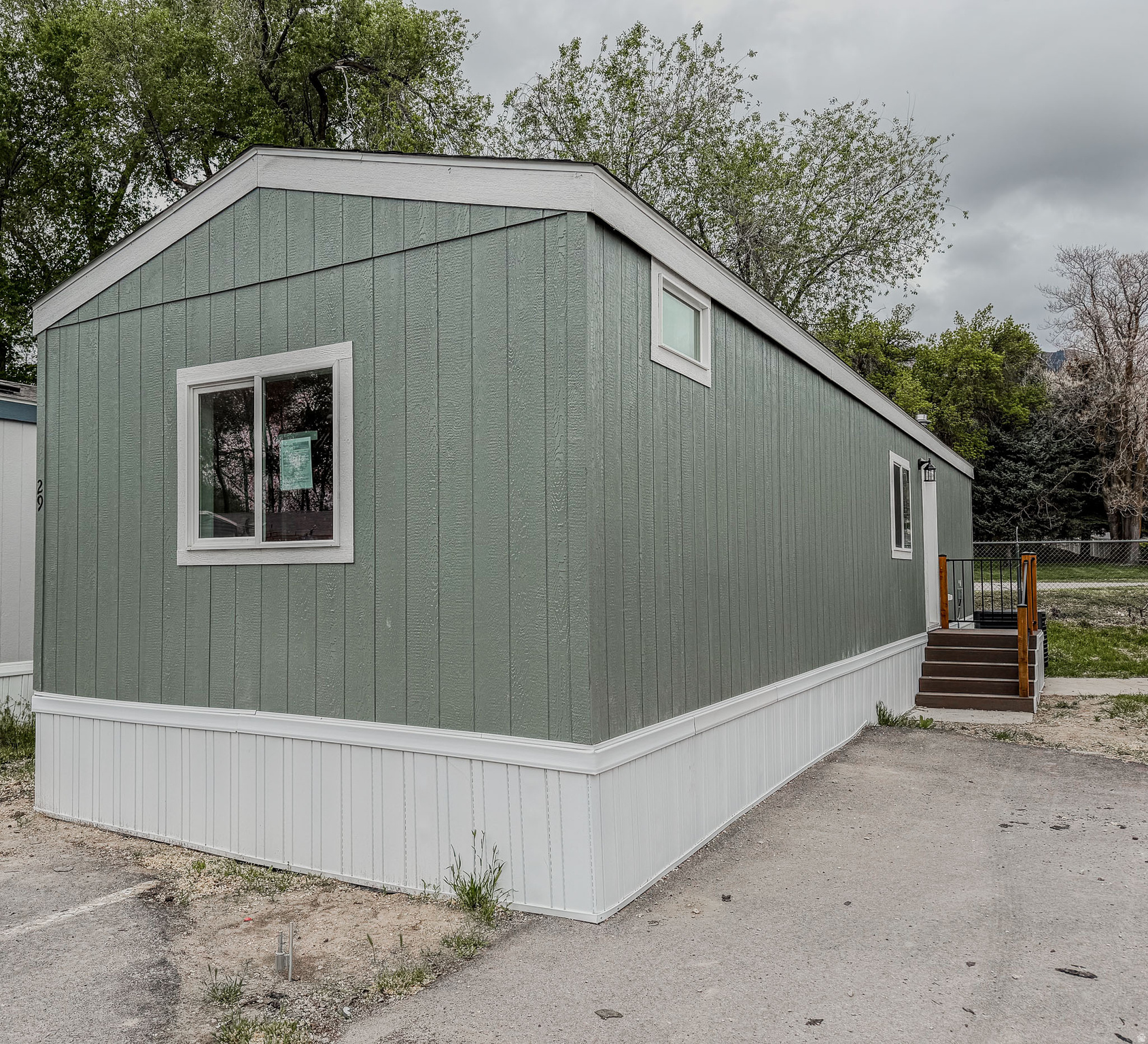 *** 1 MONTHS FREE LOT RENT and WITH PURCHASE. ***This charming 643 square feet 2 Bed 1 Bath manufactured home, built in 2026 by Cavco, offers a comfortable and efficient living space in Ogden.This thoughtfully designed residence includes a spacious living room perfect for relaxation and entertaining. The kitchen is equipped with modern appliances such as an oven, fridge, and dishwasher, making meal preparation a breeze. Additional conveniences include a laundry room with washer/dryer hook-up, a hot water heater, and central air conditioning to ensure year-round comfort. Located in the welcoming Harrisville community, this home provides residents with a friendly neighborhood atmosphere and easy access to local amenities. Harrisville is known for its well-maintained surroundings and convenient location within Ogden, offering a blend of small-town charm and city accessibility. Whether you enjoy outdoor activities, shopping, or dining, this community provides a great base to experience all that the area has to offer.
