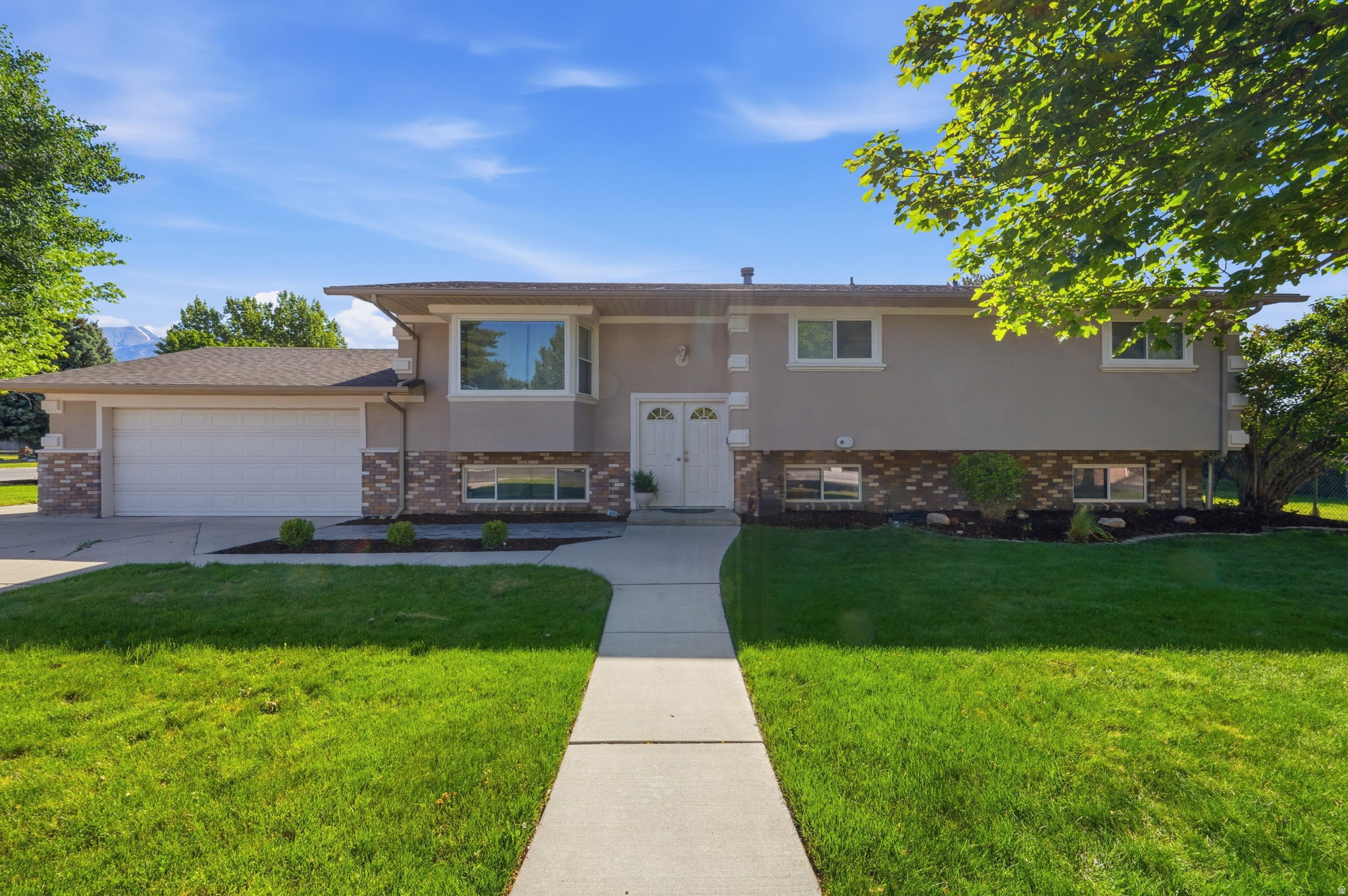 Nestled in a quiet Highland neighborhood, this spacious, light-filled home on a near half-acre corner lot has it all: beautifully manicured front & back yards, massive deck with bench seating, fully finished & heated 8' X 14' detached office/playhouse, large basketball court, mature fruit trees & berries, garden plot, and breathtaking views of Timp. Step inside and enjoy open family living, a spacious kitchen with ample cabinetry and two dining/family spaces, flexible workspace, two fireplaces, and a large family/rec room in the basement that opens to a theater room. Recently updated with new carpet, paint, top-of-the-line furnace & A/C. The smart home system and attic fan keep this home efficient and comfortable year-round. Enjoy the extra wide & deep garage with work bench. RV parking to store everything you need to enjoy the nearby parks, golf courses, trails, & AF Canyon - not to mention nearby shopping, restaurants and highly rated schools. Less than 10 minutes to Silicon Slopes/1-15. Schedule your tour of this incredible home today.