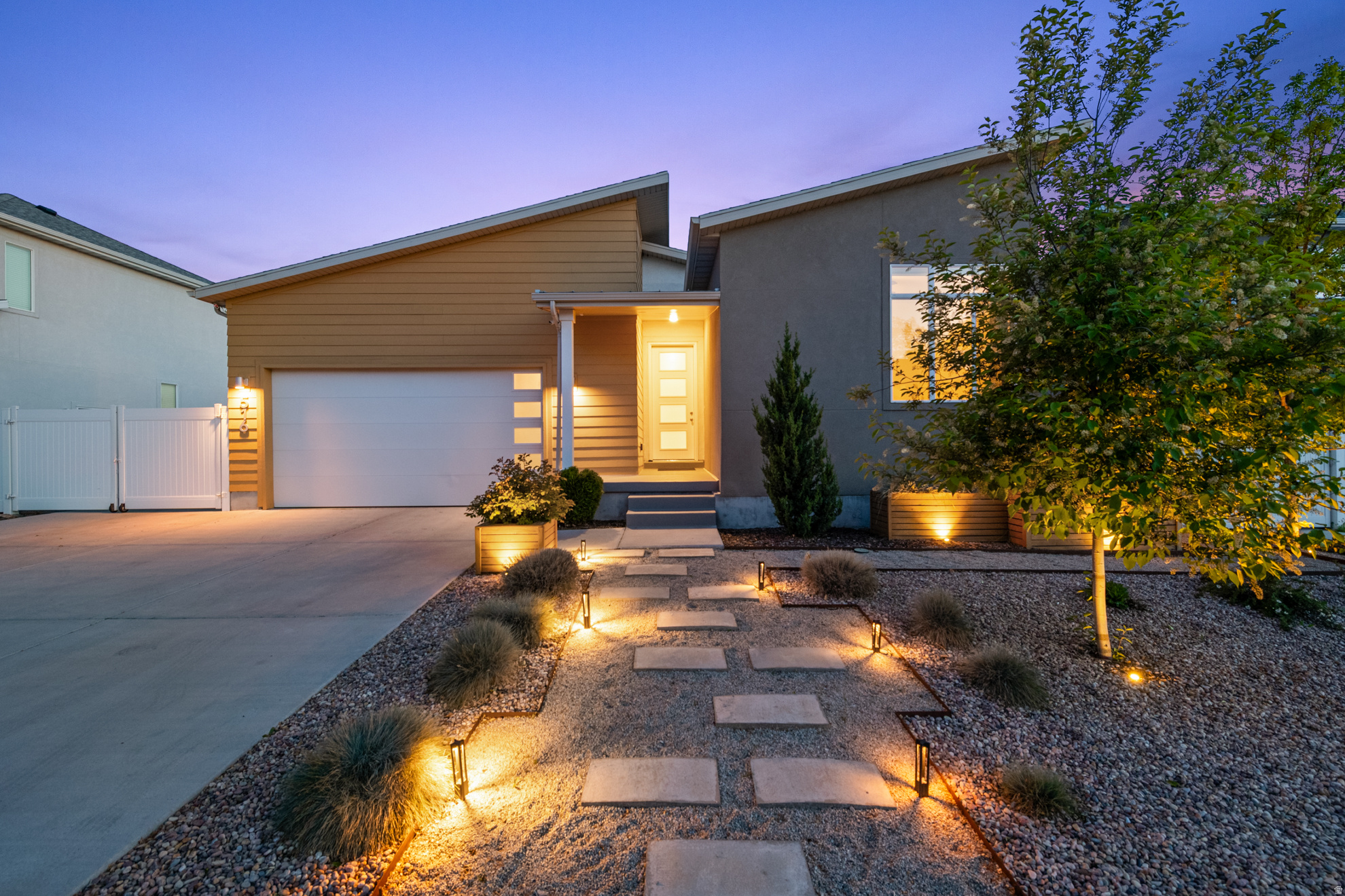 Beautifully situated in a newer Garbett Homes community in South Salt Lake on the historic site of former Granite High School, this thoughtfully upgraded home blends efficiency, design, and lifestyle. Just around the corner from the new Granite Library, enjoy easy access to parks, dining, and transportation.  Built for energy efficiency with owned solar panels, electric car charging outlet, air recovery system, reverse osmosis water filtration, and tankless water heater. Interior highlights include an upgraded gourmet kitchen, spacious primary suite with dual vanities, and a front bedroom/office with 10-foot ceiling.  The unfinished basement offers exciting future potential, including space for a possible basement apartment and separate entrance.  Outside, the owners have created beautiful curb appeal and a true backyard oasis with entertaining spaces, garden boxes, extra storage, and rare RV parking. A special opportunity in one of South Salt Lake's most exciting newer communities.    **Square footage figures are provided as a courtesy estimate only.  Buyer is advised to obtain an independent measurement.