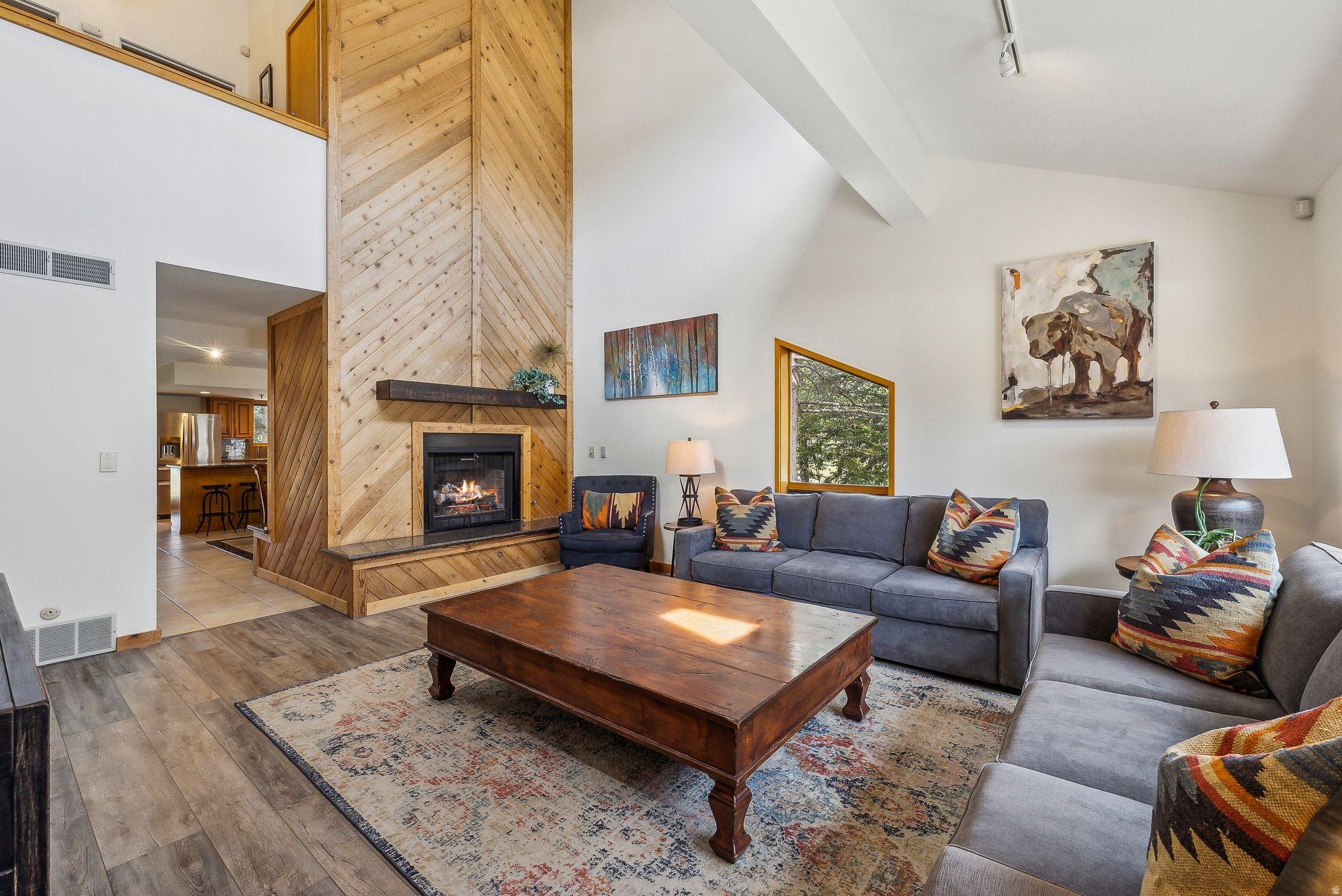 Experience serene mountain living in this 3-bedroom, 3-bath end-unit townhome in the desirable Fawngrove community of Lower Deer Valley. Surrounded by mature trees and offering breathtaking views of the tranquil ponds and iconic Deer Valley ski slopes, this exceptional Park City townhome delivers the ultimate year-round mountain lifestyle. Filled with natural light, the spacious open floor plan is designed for both entertaining and relaxing after a day of skiing, hiking, or mountain biking. The inviting living spaces flow seamlessly to a private patio where you can soak in the scenery or unwind in the private hot tub after an unforgettable day on the mountain. Additional features include a generous owner's closet, custom closet systems, dedicated ski and bike storage, and an assigned parking space in the underground garage, providing convenience and security for both full-time residents and second-home owners. Perfectly situated in Lower Deer Valley, you'll enjoy easy access to Deer Valley Resort, world-class skiing, and miles of hiking and biking trails. During the warmer months, paddleboard from your backyard or take a short walk to Historic Old Town Park City, where restaurants, boutique shopping and art galleries await. Or enjoy a summer concert on the slopes of Deer Valley. Whether you're searching for a Park City vacation home, a luxury ski property, a primary residence, or an exceptional investment opportunity with strong rental appeal, this turnkey townhome offers an unbeatable location, spectacular views, and the best of mountain living in one of Deer Valley's most desirable communities.
