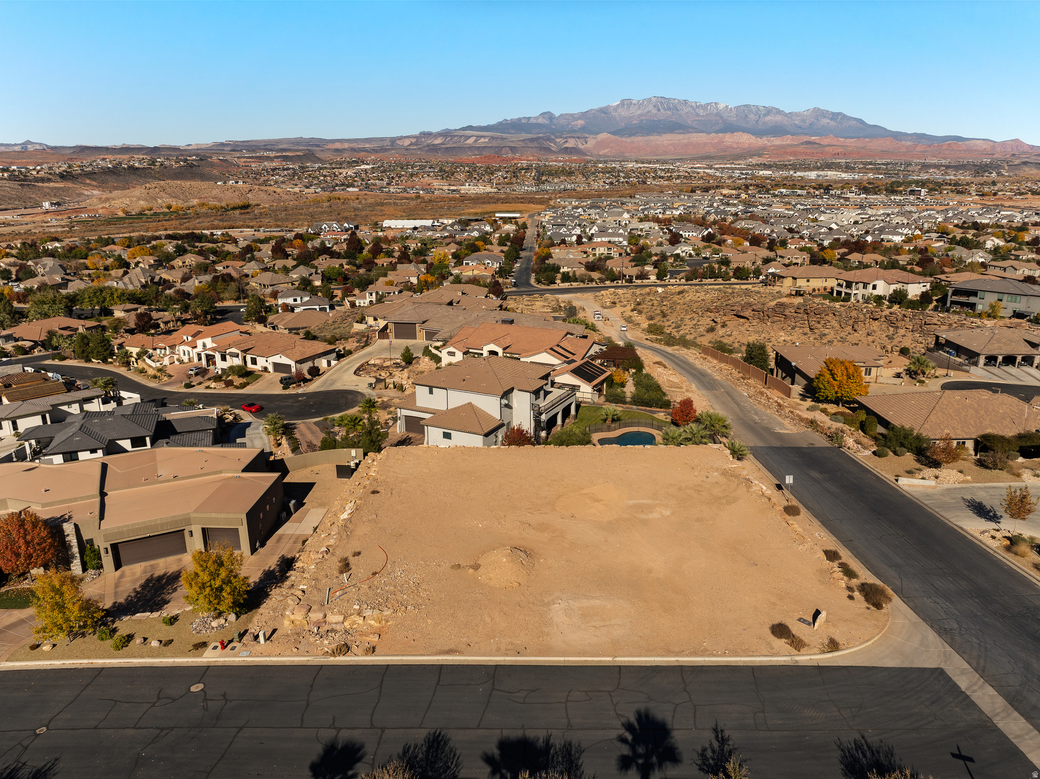 Prime 0.41-acre corner lot in the prestigious Stone Cliff community, offering exceptional views of Pine Valley Mountain and the scenic landscape to the west. This flat, graded parcel is ready for construction, providing an ideal opportunity to design a custom home in one of Southern Utah's most sought-after gated neighborhoods. For details on building restrictions and HOA information, please contact the listing agent.