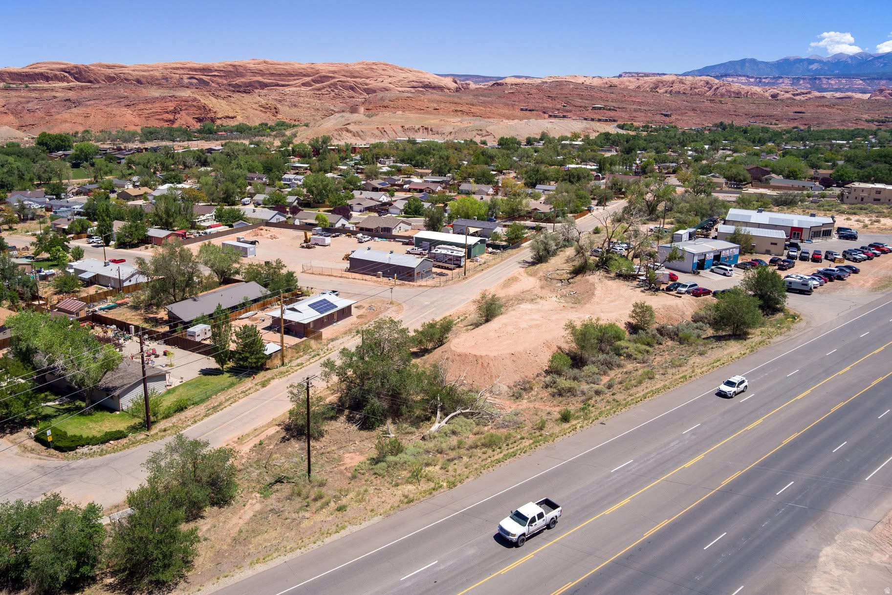 0.52 AC COMMERCIAL PARCEL! This parcel has everything you are looking for. Close approximate to town, or New College. Blt. want works for HC/SLR zone. So many possibilities. on .52 Triangle lot. That has views of the Red Rocks and the La Sal Mts. Owner Financing with qualified Buyer. Easy access off 2 sites.