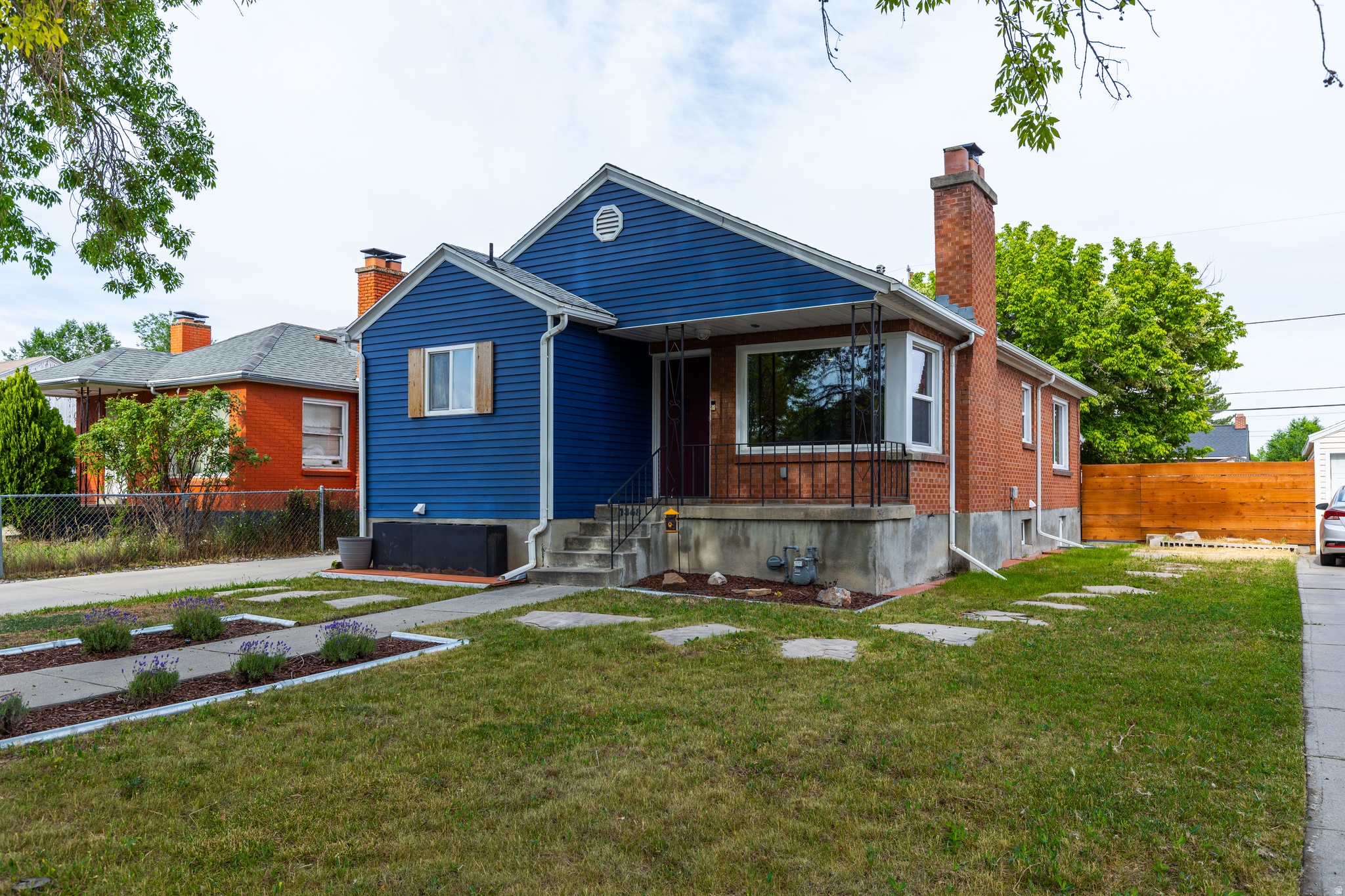 Come visit this classic mid-century modern Salt Lake City brick bungalow. Situated in a tree lined neighborhood and steps from the Jordan River Parkway trail, this home features a full Mother in Law basement apartment with a separate entrance! Recently remodeled with new windows, perma-liner in the main sewer line, and fresh interior. Brand new 50 gallon water heater installed, new radon system, and a reverse osmosis water filter on main level kitchen. This property also included a 2 car detached garage.