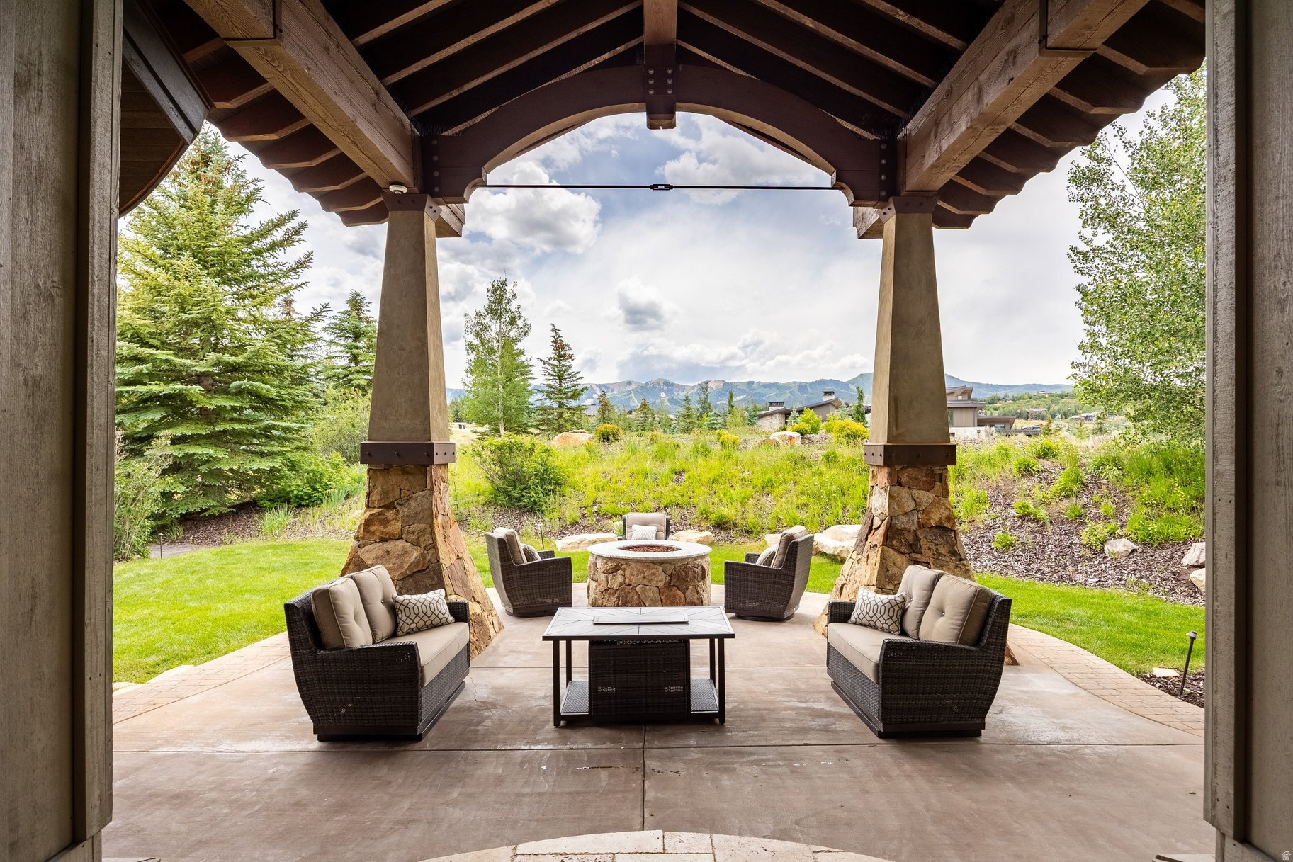 Designed by acclaimed architect Michael Upwall to embrace its spectacular surroundings, this exceptional residence offers timeless mountain living in Park City's premier gated golf community, Glenwild. Perfectly positioned at the end of a cul-de-sac with protected open space to the east, the home captures sweeping ski resort views while providing privacy and a peaceful setting and yard. Built with exceptional craftsmanship and solid construction, this home is designed for both everyday comfort and effortless entertaining. Radiant in-floor heating, air conditioning, a flat heated driveway, and an oversized heated garage with hose bibs make four-season living easy. The spacious backyard features lush lawn space for recreation, while the finished lower level offers guest suites, a wine room and theater. Oversized windows fill the theater with natural light, making it equally suited for daytime gatherings or to use as a gym. Additionally, a storage room with safes allows to to keep your valuables secure. Above the garage, a private loft with a full bath provides outstanding flexibility as a guest suite, executive office, fitness studio, or creative retreat. Glenwild is Park City's most intimate gated golf community with just 194 homesites and fewer than a dozen undeveloped lots remain, creating a mature neighborhood rather than an ongoing construction zone. Approximately 70% of homeowners are full-time or primary residents, fostering a welcoming community atmosphere. Residents may apply separately for golf or social membership at the acclaimed Glenwild Club, home to Utah's #1-rated golf course by Golf Digest, a Tom Fazio-designed championship course, exceptional practice facilities, year-round heated saltwater pool, fitness center, tennis, pickleball, dining, and vibrant social programming--all just minutes from Park City's world-class skiing, dining, shopping, and outdoor recreation. Joining the club is optional. Sq. ft. source is appraiser, buyer to verify.