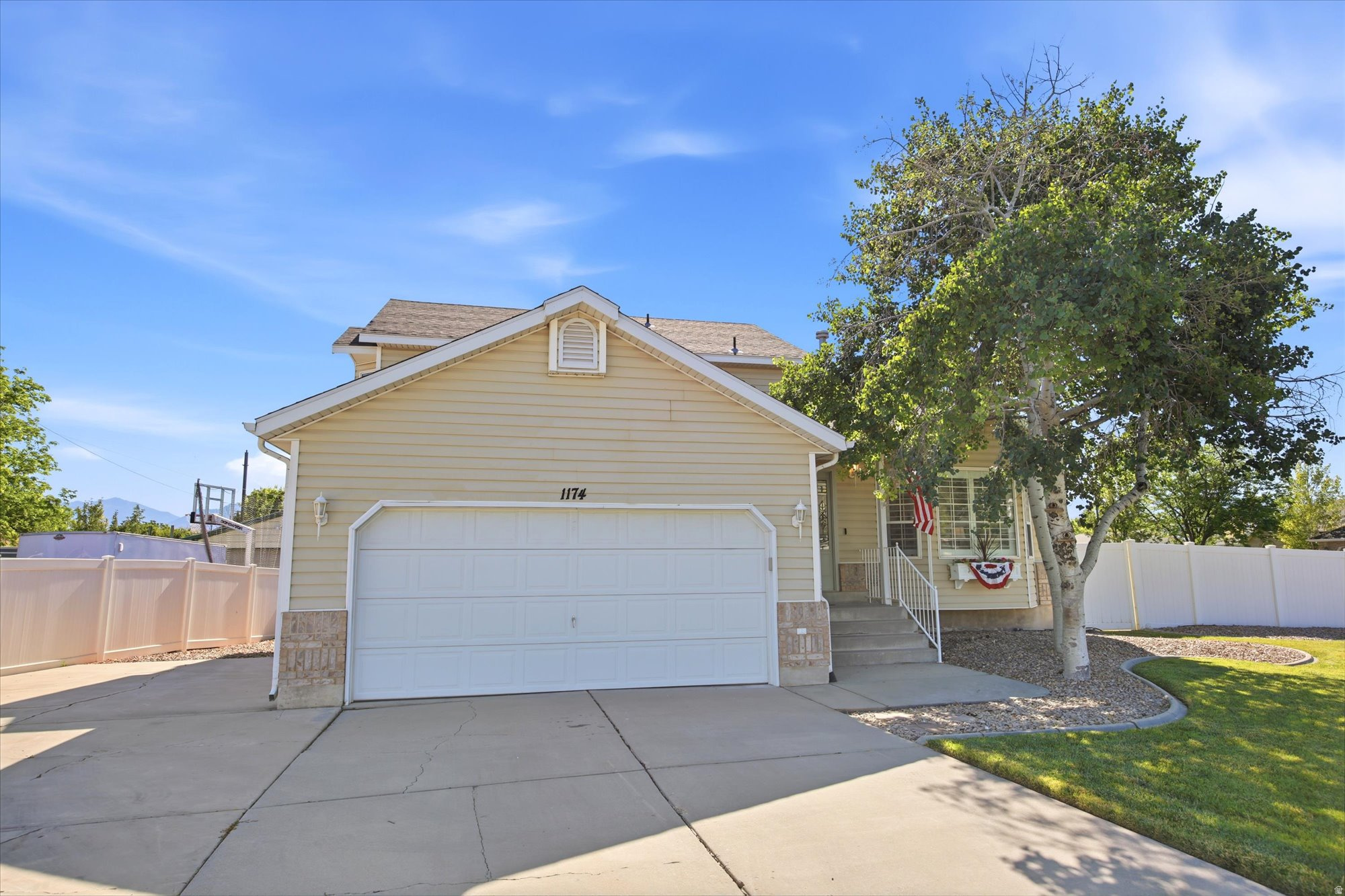 Beautifully remodeled 2-story home on a spacious corner lot with RV parking, dual backyard access, and room for a future detached garage or shop. This move-in ready home features fresh paint, updated flooring, vaulted ceilings, granite countertops, stainless steel appliances, a fully remodeled primary bathroom, new vanities, updated lighting, shiplap accents, and an abundance of natural light throughout. The finished daylight basement includes a versatile salon, fitness room, office, or flex space. Additional upgrades include a Kinetico water softener, radon mitigation system, newer water heater, 240V power in the basement, and both gas and electric dryer hookups. Enjoy the huge fully fenced yard, mature landscaping, mountain views, and extra-deep tandem garage. A rare combination of space, updates, and versatility!
