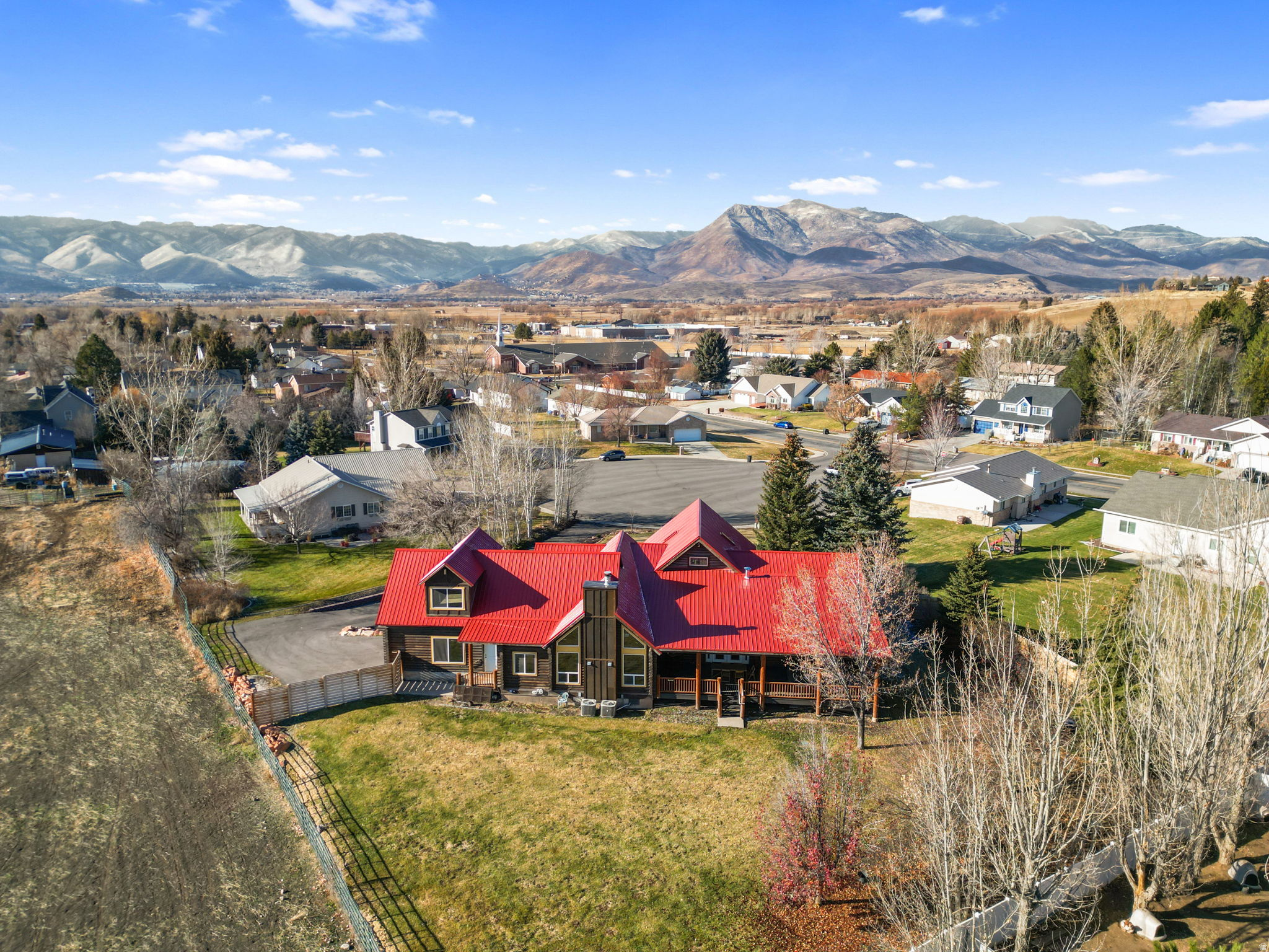 ADU with Short Term rental potential. Mountain-modern charm meets city convenience in this beautifully remodeled cabin-inspired home on a rare .71-acre lot within Heber city limits and mountain views from almost every window. Thoughtfully upgraded remodeled kitchen features sleek quartz countertops and an induction cooktop, blending contemporary style with warm cabin character. Home offers a separate basement entrance leading to a fully equipped mother-in-law apartment with living space, bedroom, and kitchen - ideal for multigenerational living or rental income.  There is no HOA. The large remodeled primary bathroom creates a private spa-like retreat. Enjoy exceptional outdoor space with a large private backyard with mountain views, perfect for entertaining, gardening, or quiet evenings with the family. Located just 10 miles to parking and skiing access near the slopes at Deer Valley East Village, and only .7 miles to downtown Heber City. Close to schools, shopping, and dining, this home delivers privacy, flexibility, and year-round lifestyle in one standout property!