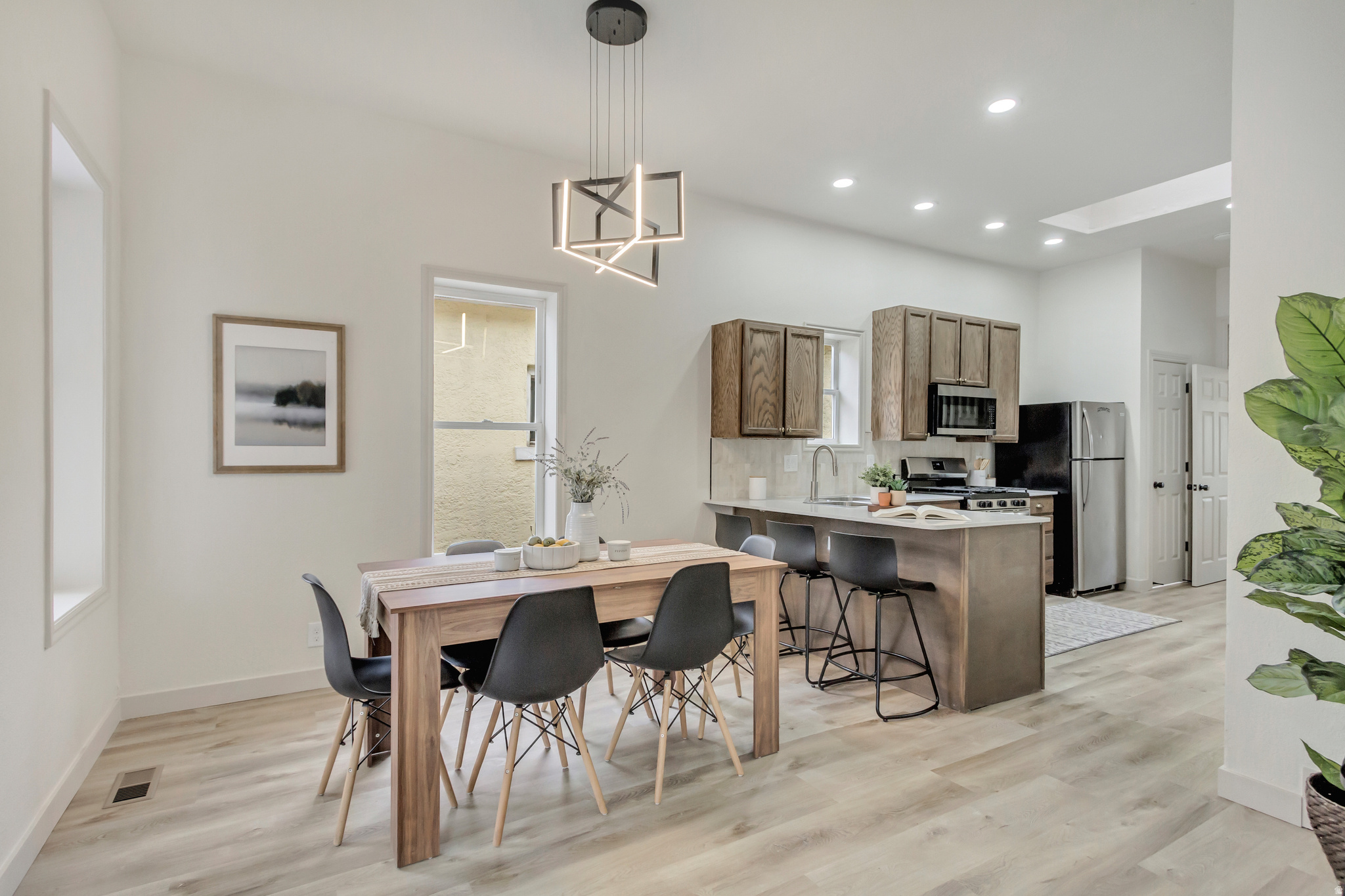 Full of character and modern updates, this beautifully refreshed 3-bedroom, 2-bathroom home offers 1,400 sq ft of inviting living space in a prime Salt Lake City location. From the moment you step inside, you'll notice the attention to detail-from brand new fixtures to the thoughtfully redesigned kitchen and living area. The updated kitchen blends style and function, perfect for both everyday living and entertaining. Upstairs, you'll find an additional bedroom with built-in shelving, adding a cozy and versatile space ideal for a home office, guest room, or creative retreat. Located in a vibrant area with easy access to everything Salt Lake has to offer, this home is a rare find that combines charm, convenience, and comfort.