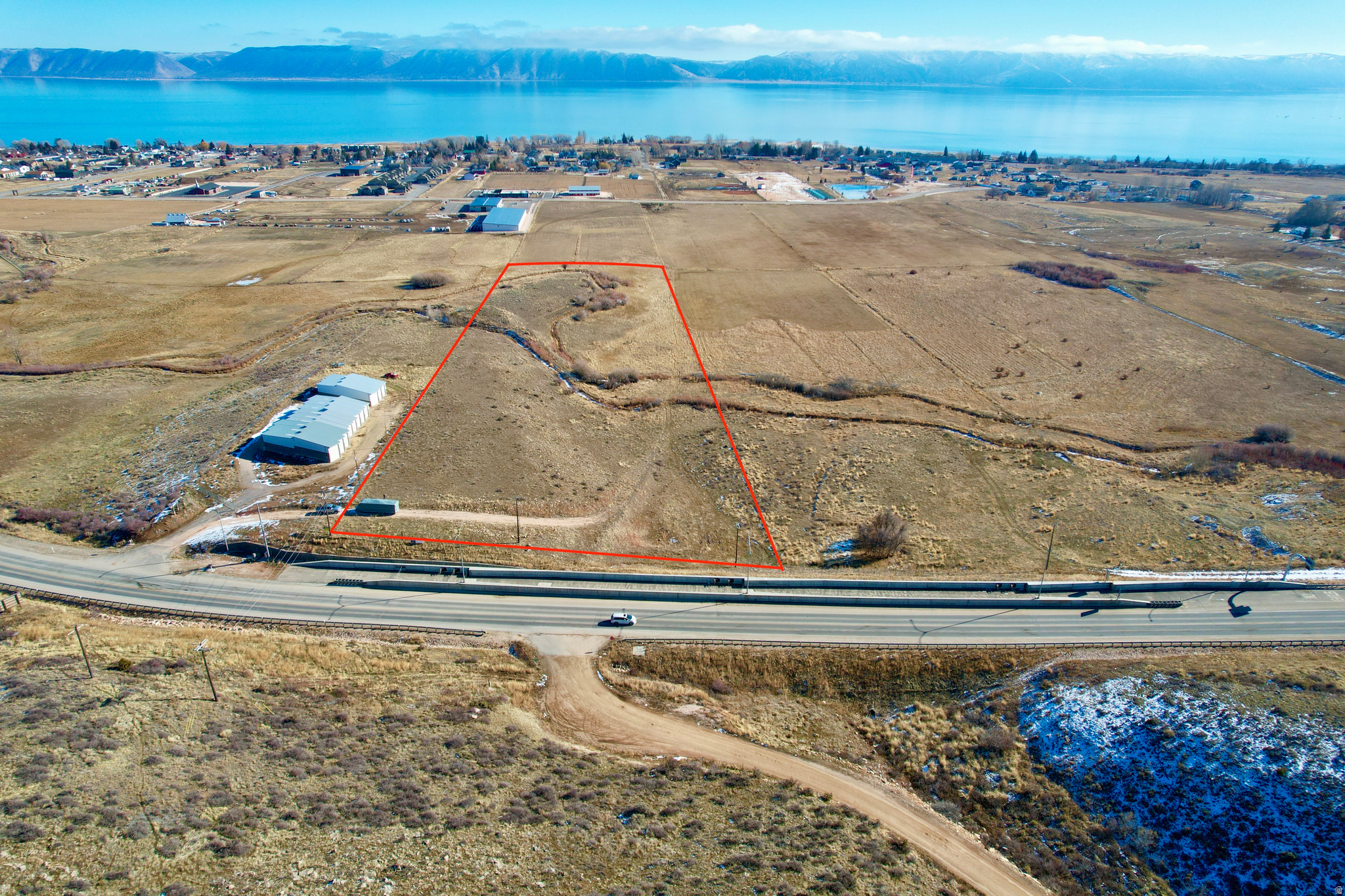 A Piece of Bear Lake ready for all you Commercial needs & ideas. This piece sits on Highway 89 from Logan to Bear Lake. It has a deeded easement for the state of Utah, some of the best views and overlooks of Bear Lake and only limited by an entrepreneurs imagination. Come take a look into your future Bear Lake business site and let's build a concept plan to bring to life!