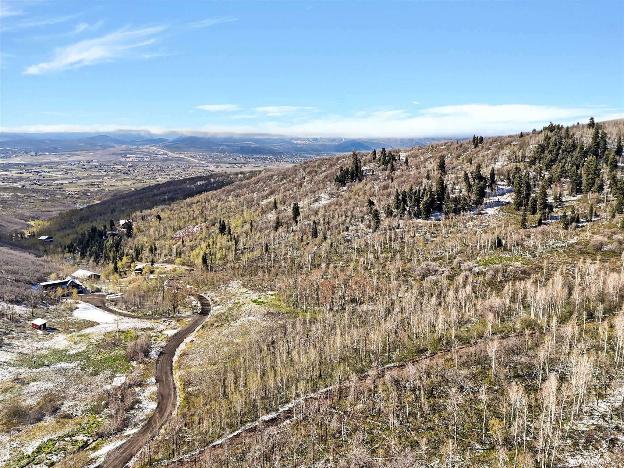 Lot 45 is a very buildable lot with multiple options. With a lower flat building site with great views , or traverse to the upper lot for even more dramatic views. This is a corner lot with more options for driveway access. 10 acres in the Park City school district. The HOA has approved paving the whole subdivision starting summer 2026.