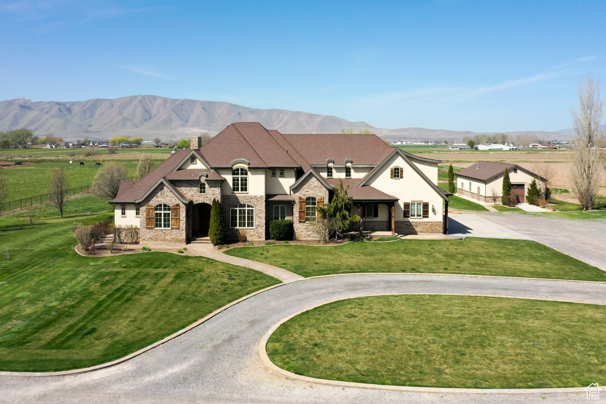 DO NOT DISTURB OCCUPANTS!  ALL VISITORS MUST BE ESCORTED BY LISTING AGENT! Discover a rare opportunity to own an expansive 8.75-acre estate in the serene landscape of Benjamin, Utah. This remarkable property boasts an 8,554 square-foot custom-built residence designed for both grand living and versatile function. Since 2012, it has been the home of Maple Lake Academy, a specialized program for boys with verbal and non-verbal learning disabilities. Step inside to find a two-story great room, a gourmet chef's kitchen, and five generously sized bedrooms, each offering comfort and privacy. Six well-appointed restrooms cater to both residents and guests. The former six-car garage has been transformed into dedicated office spaces, classrooms, and a library  ideal for a corporate retreat or a bespoke educational venture. Just steps away from the main residence, an expansive 1,492 square foot freestanding workshop, equipped with a custom shop vacuum system for efficient dust collection, offers exceptional space for hobbies, projects, or storage  perfect for cabinet making or other wood projects. The outdoor space is equally impressive. Enjoy a private basketball court, a thriving garden, and a vast covered patio complete with outdoor restroom access  perfect for entertaining or enjoying Utah's stunning sunsets. The property's expansive grounds offer endless possibilities for expansion or customization. Key Features:  8,554 SF Custom Residence (Built 2007)  1,492 SF Freestanding Workshop with Custom Shop Vacuum System (Built 2013)  8.75 Acres   5 Bedrooms, 6 Bathrooms  Gourmet Chef's Kitchen  Two-Story Great Room  Converted 6-Car Garage (Offices, Classrooms, Library)  Private Basketball Court  Established Garden  Covered Patio with Outdoor Restroom  Potential for Corporate Retreat, or Bespoke Educational Venture Shown By Appointment Only. Please Do Not Disturb Current Residents.