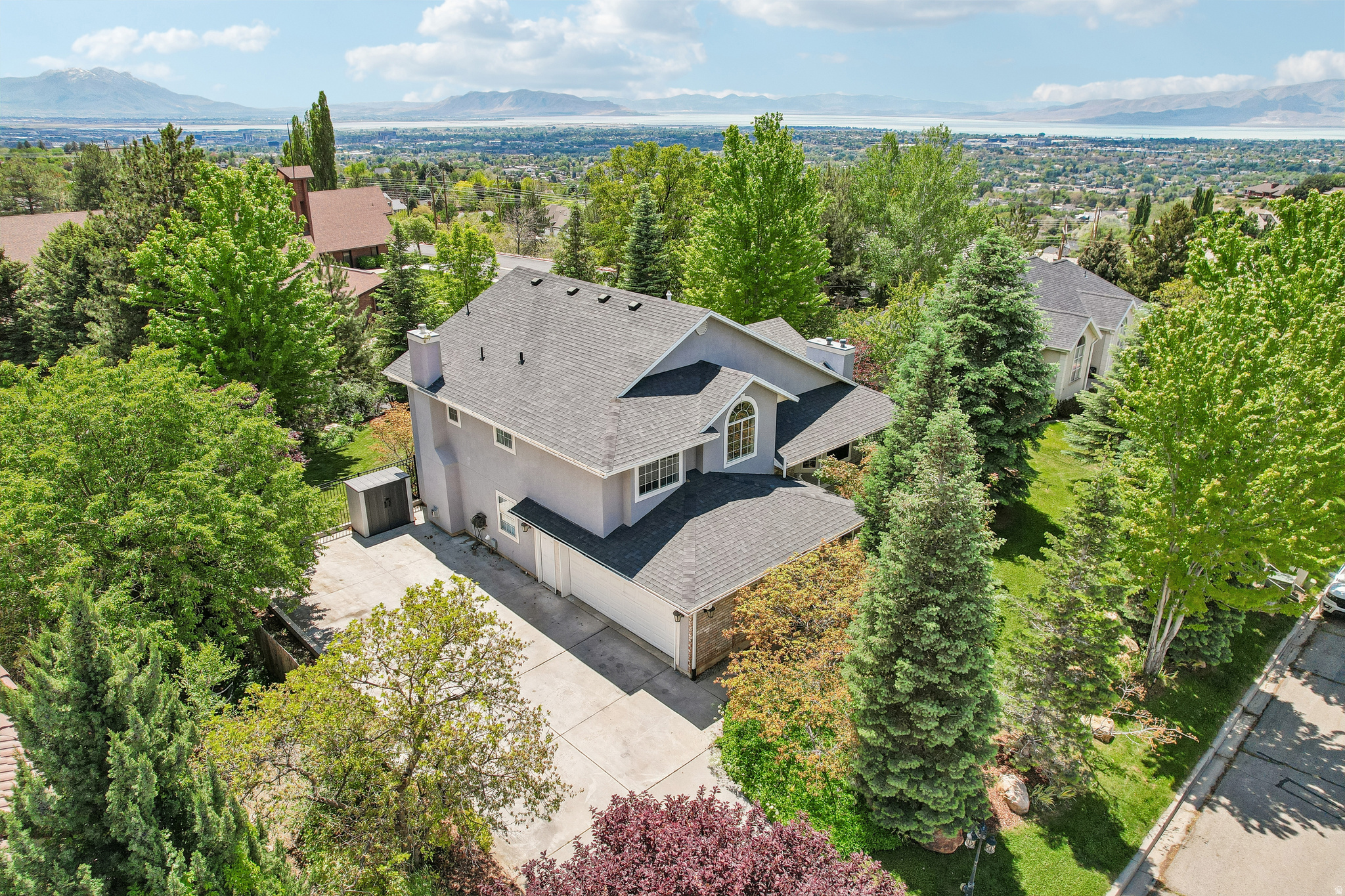 Nestled in the highly sought-after Sherwood Hills neighborhood of Northeast Provo, this exceptional 4-bedroom, 3-bathroom home offers the perfect blend of updated modern living and serene mountain surroundings. Inside, the bright and open layout features soaring ceilings. The spacious layout features a den/office and a luxurious primary suite with a separate tub/shower and walk-in closet. Step out back to enjoy the four-season Utah lifestyle on a generous lot flanked by mature trees and mountain backdrops. Positioned in an unbeatable location just minutes from Canyon Crest Elementary, Timpview High, parks, and BYU, this home offers mountain-bench living at its absolute finest. Schedule your tour today! Mortgage savings may be available through the listing agent's in-house lender; ask for details.