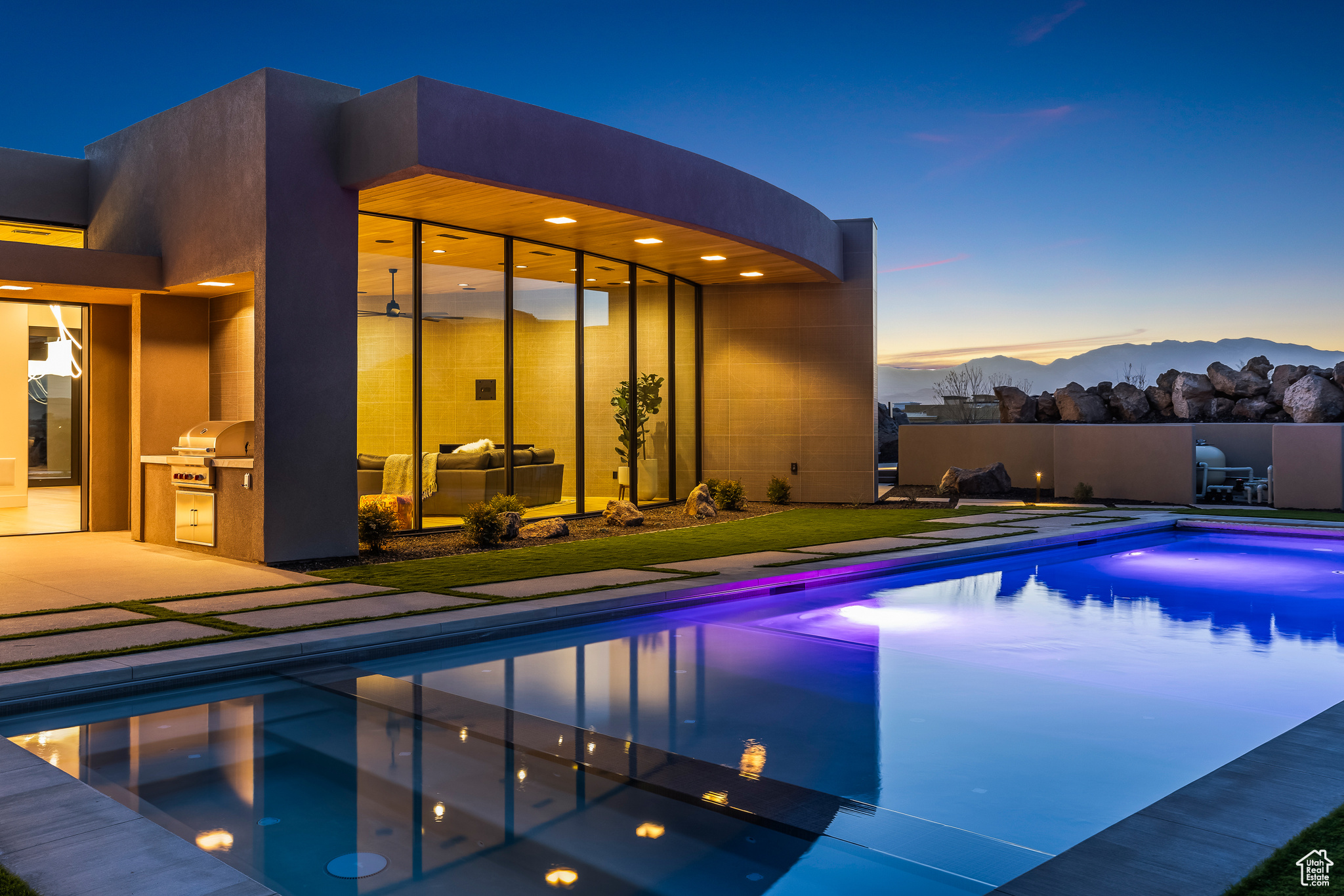 Perfectly situated among basalt rocks at the base of Snow Canyon inside Entrada Golf & Country Club, this brand-new custom home captures stunning red rock and mountain views. The great room features a striking fireplace wall, expansive windows, and views of a private backyard with heated pool, spa, outdoor fireplace, built-in BBQ kitchen & TV hookups. The chef's kitchen offers Riverwoods Mill cabinets, Wolf/Subzero appliances, waterfall island, butler's pantry, and hardwood floors. The primary suite includes a luxury bath, gym, spacious closet with W&D and private patio access. Additional features: office, casita, ensuite bedrooms, 4-car garage w/ EV charger, Crestron Home automation, motorized shades, solid wood doors and so much more!  All information is deemed reliable but not guaranteed, buyer to verify all.