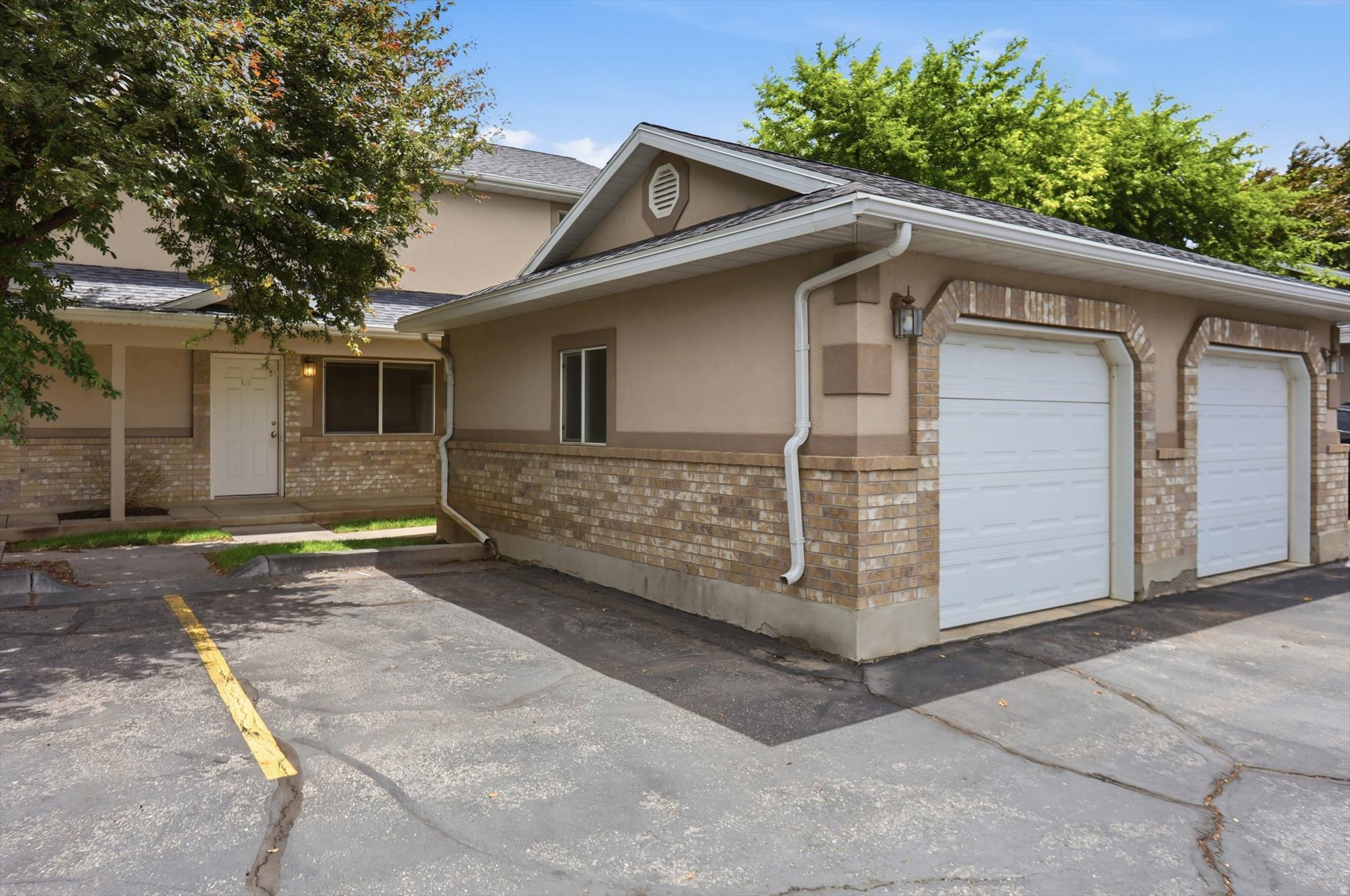 Townhouse-style condo in North Ogden featuring 2 spacious bedrooms and 1.5 baths, a generous sized kitchen, and a convenient main-level laundry.  Detached single car garage located directly in front of unit plus 1 parking space in front. Enjoy beautifully maintained grounds and one of the lowest HOA fees in the area. Close to North Ogden Pool and shopping. Great opportunity for affordable, low maintenance living in a desirable location.