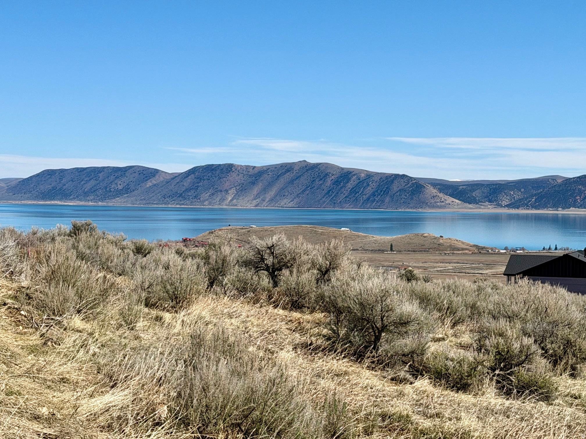 Build your dream getaway on this stunning 0.58 acre lot in beautiful Bear Lake! This gently sloped property offers stunning lake and mountains views with common ground below down to the lower road adding open space and protection of the incredible views.  Enjoy year-round access and ride directly to miles of off-road trails.  Short-term rentals are not currently being restricted and offer investment potential. For an additional fee, Home owners have optional access to Ideal Beach Resort amenities including, private Beach access, swimming pools, hot tubs, saunas and more!  The perfect opportunity to build a personal retreat, vacation rental or year round residency awaits!