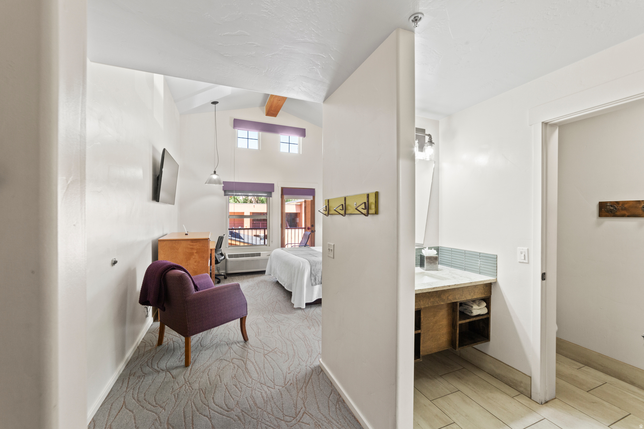 Downtown Moab Condotel Investment at the Gonzo Inn  Rare opportunity to own a fully furnished 2-bedroom, 2-bathroom condotel unit at the Gonzo Inn, located in the heart of downtown Moab. This income-producing property offers the perfect combination of investment potential and personal getaway, with professional on-site management available. The spacious unit features dramatic vaulted ceilings, two private balconies, and stunning views of Moab's iconic red rock cliffs. Designed for comfort and relaxation, the interior includes a bright living area, wet bar, and thoughtfully furnished spaces ideal for guests or owners alike. Owners and guests enjoy resort-style amenities including a pool and hot tub, all just steps from Moab's vibrant downtown shops, restaurants, and adventure outfitters. Arches National Park, world-famous mountain biking trails, hiking, and off-roading are only minutes away. Whether you're looking for a turnkey short-term rental investment or a personal Moab retreat, this unique condotel opportunity places you in one of the most desirable locations in town.