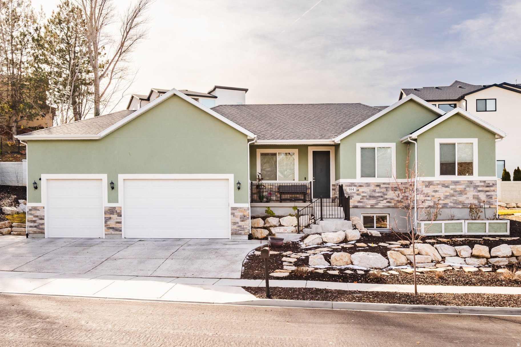 This thoughtfully designed, new-construction rambler is ideally located in a neighborhood with mature trees and stately homes. Enjoy the proximity to Mick Riley Golf Course, County Ice Center, IHC Hospital, shopping, restaurants, freeway access, and many parks. Completed early in 2023, this home features a primary bedroom with en-suite on both levels, an approved rental (ADU) on the lower level with a separate entrance, energy-efficient appliances in the gourmet kitchens, solar panels with a battery backup, epoxy floors, and an electric car charger in the large three-car garage (50 AMP), HVAC split for the lower level and main level, as well as a radon mitigation system.