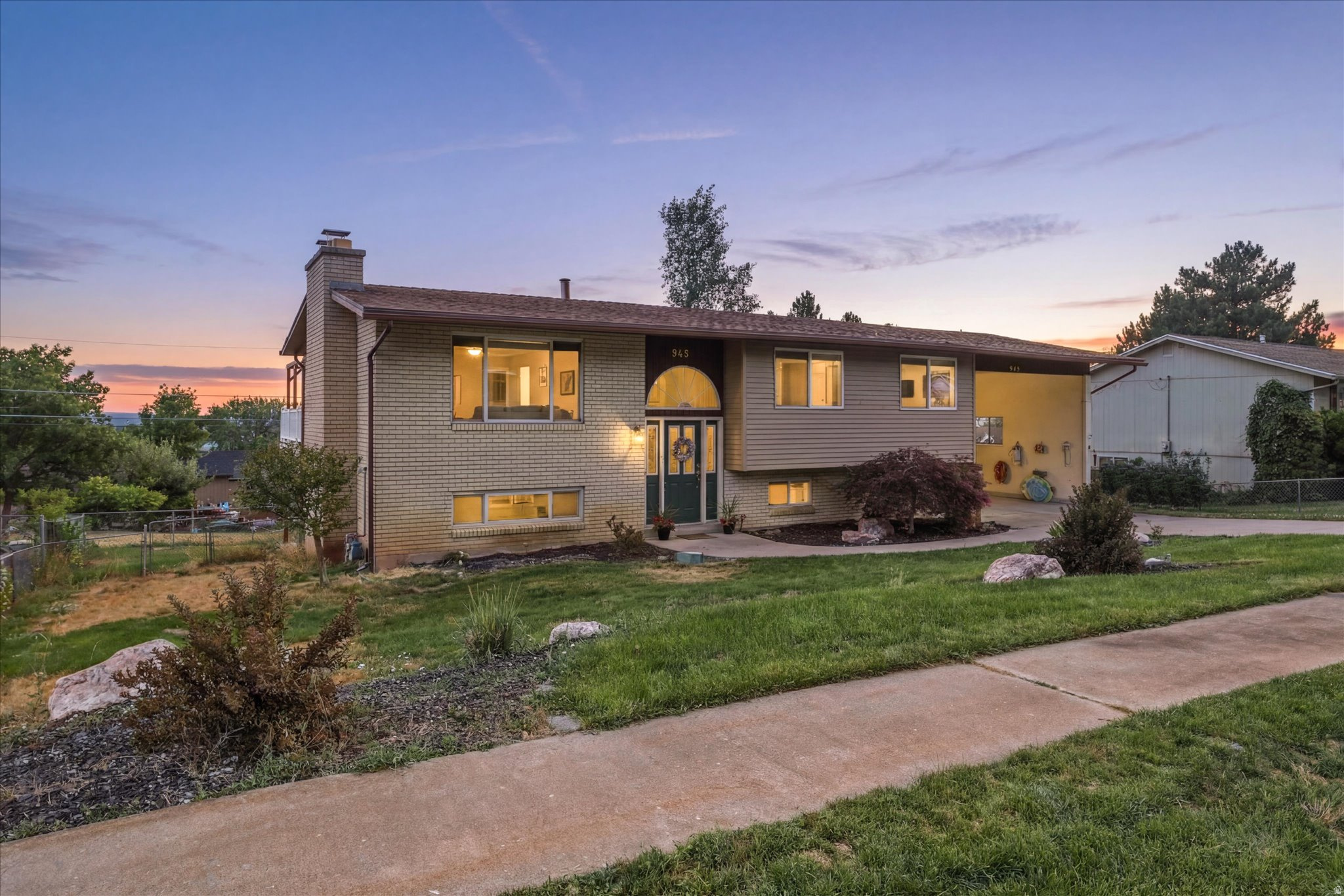 Perched along the coveted Ogden Divide, this spacious North Ogden home offers the kind of views you'll never grow tired of. Wake up to the Wasatch Mountains, unwind with breathtaking valley sunsets, and enjoy one of the area's most desirable locations, just minutes from world-class hiking, skiing, shopping, dining, and everything North Ogden has to offer.  Inside, you'll find 2,332 square feet of living space with 5 bedrooms, 2.5 bathrooms, and room for everyone. Sunlight pours through the large picture windows, creating a warm and inviting atmosphere, while the functional layout offers multiple gathering spaces for everyday living and entertaining.  The fully finished walkout basement with a separate entrance provides exceptional flexibility, making it ideal for guests, a home office, a recreation room, or additional living space. Outside, mature landscaping, a fully fenced backyard, covered patio, and open porch create the perfect setting for relaxing or hosting family and friends.  With panoramic mountain and valley views, generous parking, an extra-height covered carport, and an unbeatable location, this home offers the perfect balance of comfort, space, and scenery. Come experience why this is one of North Ogden's most sought-after places to call home.