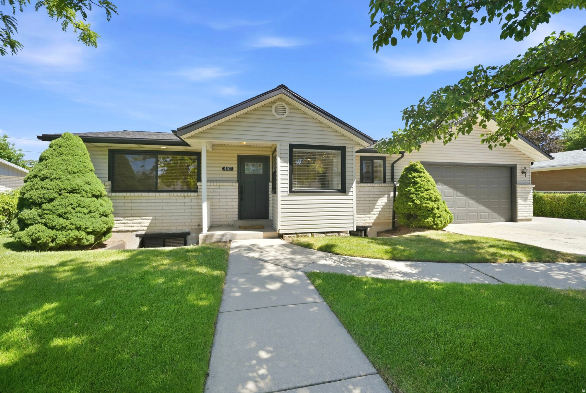Completely renovated and move-in ready, this beautifully updated rambler blends modern finishes with exceptional functionality. Nearly every surface has been refreshed with brand-new flooring throughout, fresh interior paint, updated window coverings, new appliances, stylish quartz countertops, and a fully remodeled main-level bathroom featuring an oversized wheelchair-accessible shower. The bright, open layout is filled with natural light and offers spacious living areas, including a large second family room in the finished basement, providing flexible space for entertaining, relaxing, or a home theater. Outside, you'll find a rare combination of space and versatility with a heated oversized garage, RV parking, and a fully fenced backyard with no rear neighbors for added privacy. Enjoy mature fruit trees, raised garden beds, and a thriving vegetable garden, with plenty of room to relax, play, or grow your own produce. Conveniently located near shopping, schools, parks, and commuter routes, this turnkey home combines thoughtful updates, accessibility, generous indoor and outdoor living spaces, and a setting that's increasingly hard to find