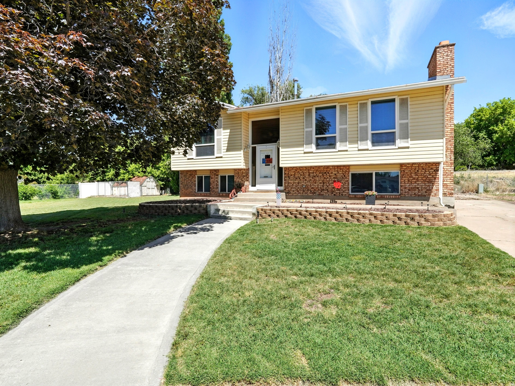 Welcome to this beautifully updated home tucked away in a quiet Roy cul-de-sac! With modern updates throughout-including new flooring, a updated kitchen with granite countertops, and an inviting layout. The living room features a cozy brick fireplace and large windows that let in tons of natural light. Downstairs, the oversized primary suite offers a second fireplace and plenty of space to relax or work from home. Step outside to a spacious backyard with a raised deck-perfect for entertaining or soaking up the sunshine. Located just minutes from parks, schools, and shopping, this home is the perfect blend of comfort and convenience