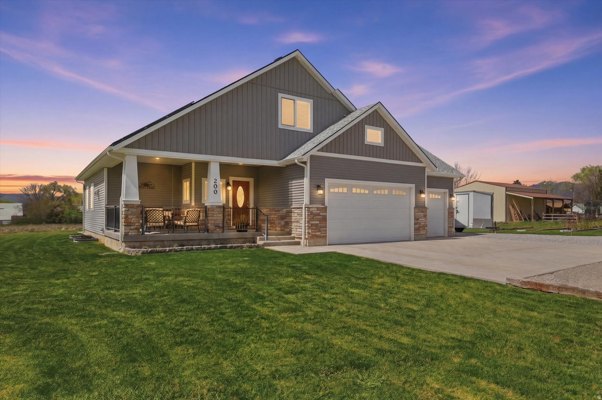 Price Improvement! Tucked away at the end of a dead-end road on 2.38 beautifully landscaped acres, this custom home offers privacy and seclusion while being just a short walk from schools. Inside, the bright open-concept living, dining, and kitchen area features quartz countertops and a warm fireplace-perfect for spring mornings. The main-floor with a primary suite is a true retreat with its tiled walk-in shower, and there's even a cozy main-floor office. Upstairs and Downstairs you'll find Four more bedrooms and a total of TWO family rooms, giving everyone plenty of space for play and movie nights! Outside, enjoy the large covered front porch with its inviting porch swing for watching the sunrise. Entertain around the firepit, harvest fresh raspberries from the massive garden, or make use of the chicken coop and shed. There's plenty of room for horses or expanding your homestead dreams. Additional perks include fully paid solar panels, a 3-car garage, and extra parking. Beautifully crafted with down-home living in mind, call to schedule your showing today!