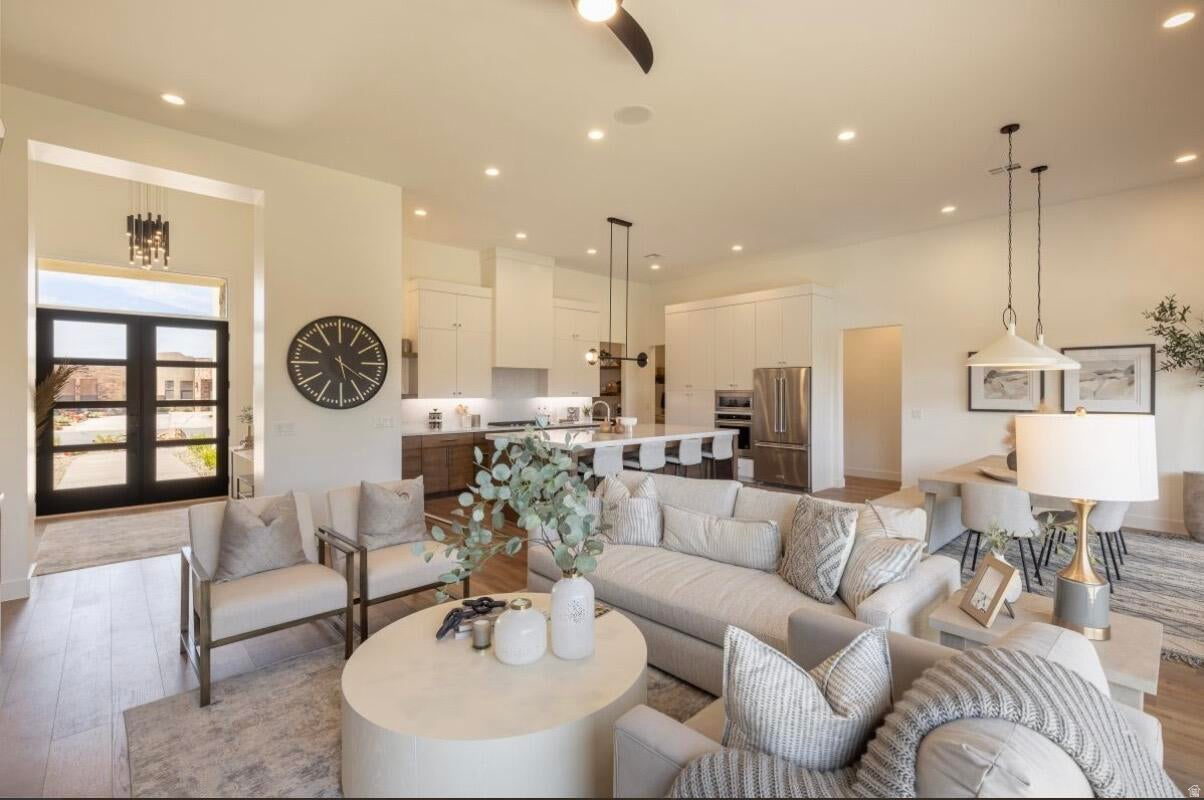 Formerly featured in the 2022 Parade of Homes, this stunning turnkey, nightly rental-approved property offers the perfect blend of luxury, comfort, and investment potential. This beautifully designed 3-bedroom, 3.5-bathroom home welcomes you with a bright, open-concept floor plan that's ideal for entertaining. The spacious living area is anchored by a cozy gas fireplace, creating an inviting atmosphere for gathering with family and friends. The gourmet kitchen is loaded with premium upgrades, including high-end appliances, elegant quartz countertops, and a spacious butler's pantry that adds both style and functionality. Guests will love the casita, complete with its own entrance and convenient kitchenette, offering the perfect space for visitors. Step outside to your private backyard retreat, where a putting green and outdoor fireplace create the ultimate setting for relaxation and entertaining under the stars. As part of this sought-after community, you'll also enjoy access to resort-style amenities, including a sparkling pool, hot tub, fitness center, and pickleball courts. Whether you're searching for a luxury vacation home, an income-producing short-term rental, or both, this exceptional property delivers. Don't miss this opportunity to own a Parade of Homes showcase home with outstanding investment potential.