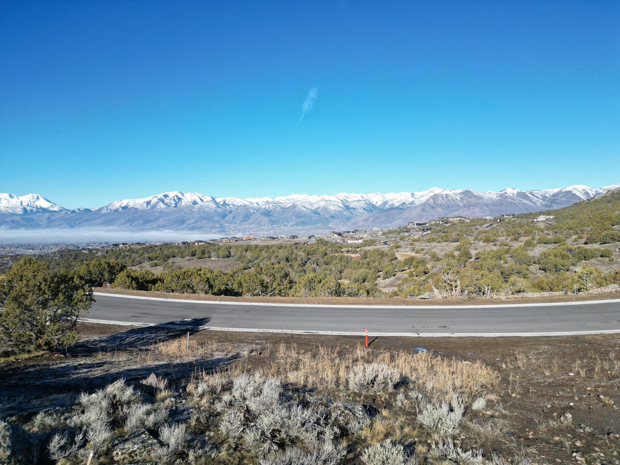 Discover an exceptional opportunity to build your mountain retreat on this premier homesite in the coveted Red Ledges community. Set to capture sweeping panoramic views of Mt. Timpanogos and the Heber Valley, this property offers a remarkable balance of privacy, natural beauty, and refined mountain living.  Surrounded by year-round recreation and scenic open space, the lot provides an ideal canvas for a custom home designed around both comfort and connection to the outdoors. Enjoy access to Red Ledges' renowned amenities, including the Jack Nicklaus Signature Golf Course, clubhouse, fitness facilities, tennis and pickleball courts, dining, and a vibrant calendar of community events. With all levels of club membership available, this homesite presents a rare opportunity to create a legacy property in one of Utah's most sought-after private communities.