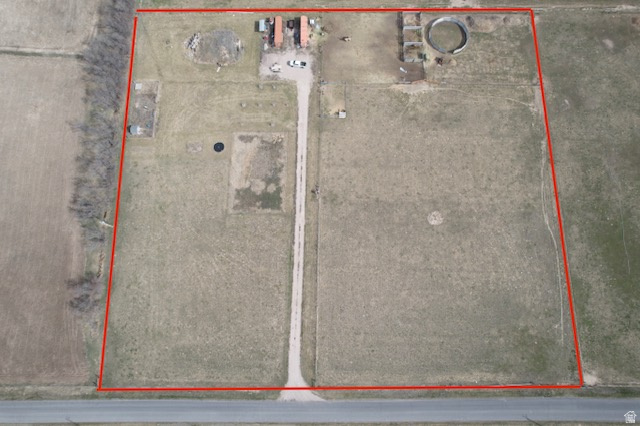 This one is a must see!  5.91 acres with plenty of paved road frontage for building a homestead.  A culinary spring is plumbed to the lot.  17cfs of owned irrigation rights from 5 Mile Creek is also included.  There is a pump and irrigation equipment on site to pressurize the water and irrigate the entire parcel!  Fruit trees are planted, and there is a round pen and 3 stalls already built, allowing you to focus on building your dream home.  Buyer to verify all information.