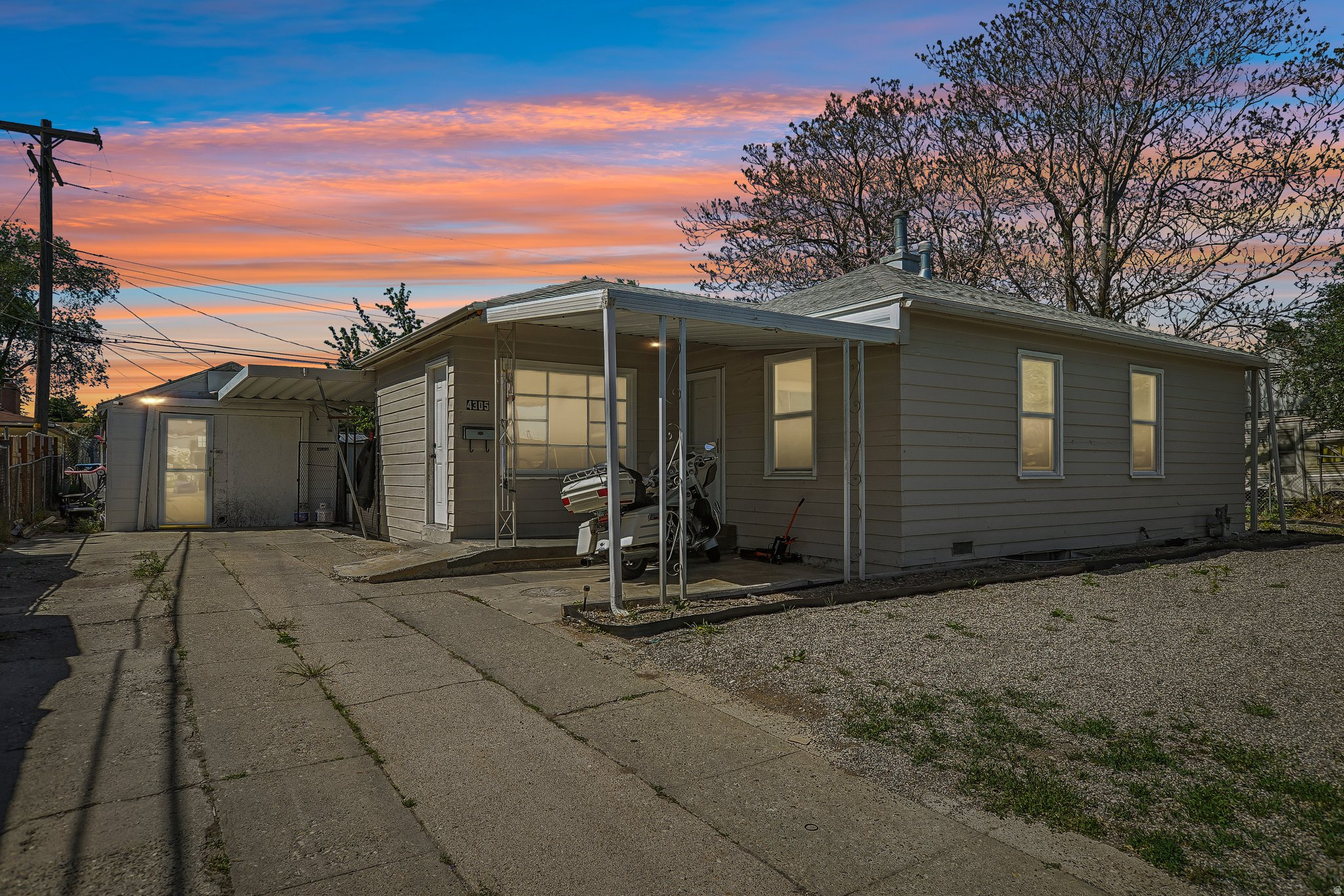 Updated home with tons of outdoor entertaining space and incredible RV parking, located just a 3-minute walk from South Kearns Elementary School. Features include granite countertops in kitchen and bath, stainless steel appliances approximately 12 years old, canned lighting, and newer covered front and back porches. Detached single-car garage has been converted into an awesome home gym/flex space. Backyard is designed for low maintenance and maximum enjoyment with a covered pergola, 9-person hot tub, outdoor movie setup, above-ground pool, trampoline, dog run, and two storage sheds. Massive RV parking with room for both an RV and boat. With a full-price offer, all backyard amenities and gym equipment are included. Home could use a little TLC, but offers great value, functional updates, and an amazing setup for entertaining and outdoor living.