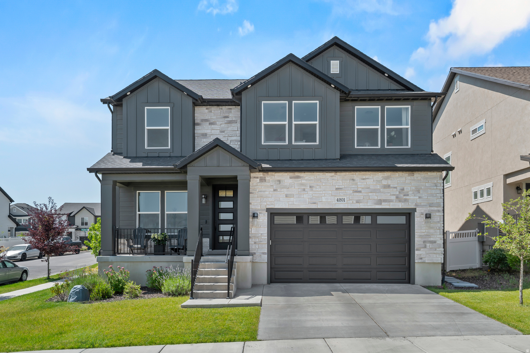 Incredible Corner Lot with Unobstructed Views & $70K in Upgrades! This beautifully upgraded home blends modern elegance with thoughtful, functional design. Soaring ceilings create an open, airy feel, while the spacious layout is perfect for both everyday living and entertaining. The chef's kitchen is a true centerpiece, featuring quartz countertops, a large island, soft-close cabinetry, and a walk-in pantry. The open-concept living room is filled with natural light from expansive windows and anchored by a stunning floor-to-ceiling fireplace. Retreat to the serene primary suite, accessed through elegant French doors. This private oasis includes a vaulted ceiling, a luxurious ensuite bath with a barn door, soaking tub, walk-in shower, and a generous walk-in closet. Additional highlights include a well-appointed laundry room with a utility sink, a tankless water heater, and an unfinished basement with 9-foot ceilings-offering endless possibilities to customize and expand. Ideally located near top-rated schools, parks, and shopping, this home offers the perfect balance of comfort, style, and convenience. A MUST SEE!