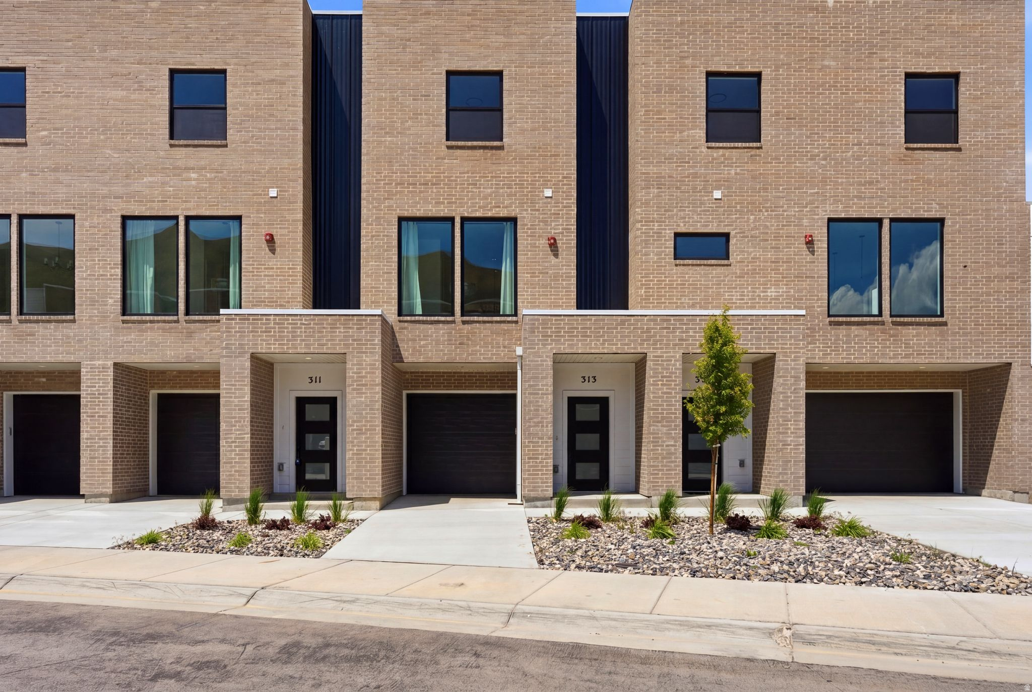 Last few new construction units remaining. Step into this thoughtfully designed 3-bedroom, 3.5-bath townhouse offering breathtaking views of the Salt Lake Valley and modern-day comfort throughout. Large windows invite abundant natural light into the home, enhancing the open and airy feel of each space. The kitchen connects effortlessly to the main living and dining areas, creating an ideal layout for both relaxed daily living and hosting gatherings. The property includes a one-car garage plus an additional driveway parking spot for added convenience. The spacious primary suite serves as a private retreat, featuring its own en-suite bath and generous closet space. Two additional bedrooms, each with access to full bathrooms, offer flexibility for guests, family members, or a dedicated home office. Located just moments from outdoor adventures, shopping centers, restaurants, and easy freeway access, this home delivers comfort, quality, and convenience in one of the valley's desirable areas. Enjoy stylish living with scenic surroundings in this exceptional Salt Lake Valley townhouse.