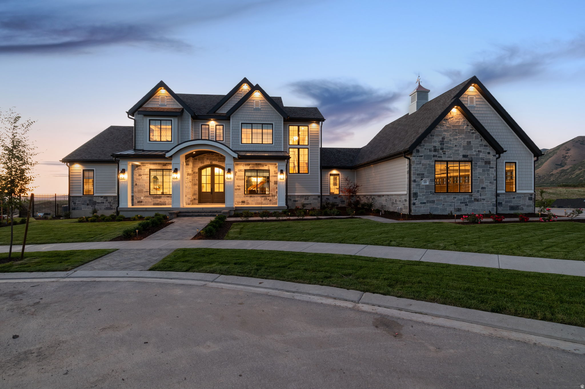 Judges Choice award winner!!! 2026 Parade of Homes showcase property. Private showings unavailable during the Parade. Showings to begin June 22, 2026. Please contact listing agent for additional information and showing arrangements.  2026 Parade of Homes masterpiece showcasing timeless elegance, impeccable craftsmanship, and breathtaking views of Utah Lake and the surrounding mountains. Thoughtfully designed with a commitment to quality and detail at every turn, this extraordinary residence seamlessly blends luxury, comfort, technology, and wellness into one remarkable living experience.  From the moment you enter, you'll be captivated by soaring spaces, extensive wood flooring, custom cabinetry, exquisite stonework, and impressive finish carpentry throughout.  Every detail has been carefully selected to create a home that feels both refined and inviting. The chef's kitchen is anchored by a breathtaking oversized statement island, creating a stunning focal point and natural gathering space at the heart of the home. Premium Sub-Zero refrigeration, Wolf appliances, Cove dishwashers, a fully equipped butler's pantry, and beautifully integrated living and dining spaces make the home equally suited for intimate evenings and large-scale entertaining.  Designed to elevate everyday living, the home offers an exceptional collection of amenities rarely found under one roof.  The private wellness retreat features a steam room, sauna, freestanding soaking tub, whole-home water filtration system, and spa-inspired spaces designed for relaxation and rejuvenation. Entertainment and recreation spaces include a golf simulator room, expansive gathering areas, integrated audio and home theater features, and seamless indoor-outdoor living throughout.  Technology and infrastructure were given the same level of attention as the finishes.  The home is equipped with a comprehensive Control4 smart home system managing lighting, audio, HVAC, televisions, security, cameras, and motorized blinds. Additional features include a Generac generator, EV charging station, extensive Ethernet wiring, Wi-Fi expansion system, Leak Defense System, Bull water storage system, tankless water heaters, security system, and numerous custom upgrades throughout.  Outdoor living was designed to rival the interior spaces, with professionally landscaped grounds, expansive entertaining areas, outdoor heaters, fire pit, water feature, grilling area, extensive exterior lighting, engineered retaining walls, and multiple view-oriented patios that capture the beauty of Utah's mountains and lake. Cedar soffits, natural stone accents, a copper-roof cupola with weathervane, and carefully selected architectural details further distinguish the home's timeless design.  Additional highlights include soaring 12-foot basement ceilings, a secure safe room featuring a Fort Knox vault door, epoxy-finished garage and utility spaces, laundry facilities on every level, extensive storage, and countless custom upgrades that reflect a true no-expense-spared approach to construction.   Appliances, exercise equipment, and televisions are included. For buyers seeking a truly turnkey luxury experience, the professionally curated designer furnishings may be purchased separately for $200,000, allowing the home to be enjoyed exactly as envisioned.  A rare opportunity to own one of Utah County's premier luxury residences-an exceptional Parade Home where craftsmanship, design, technology, wellness, and lifestyle come together in perfect harmony.